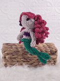 Handmade mermaid crochet plushie shown from the front