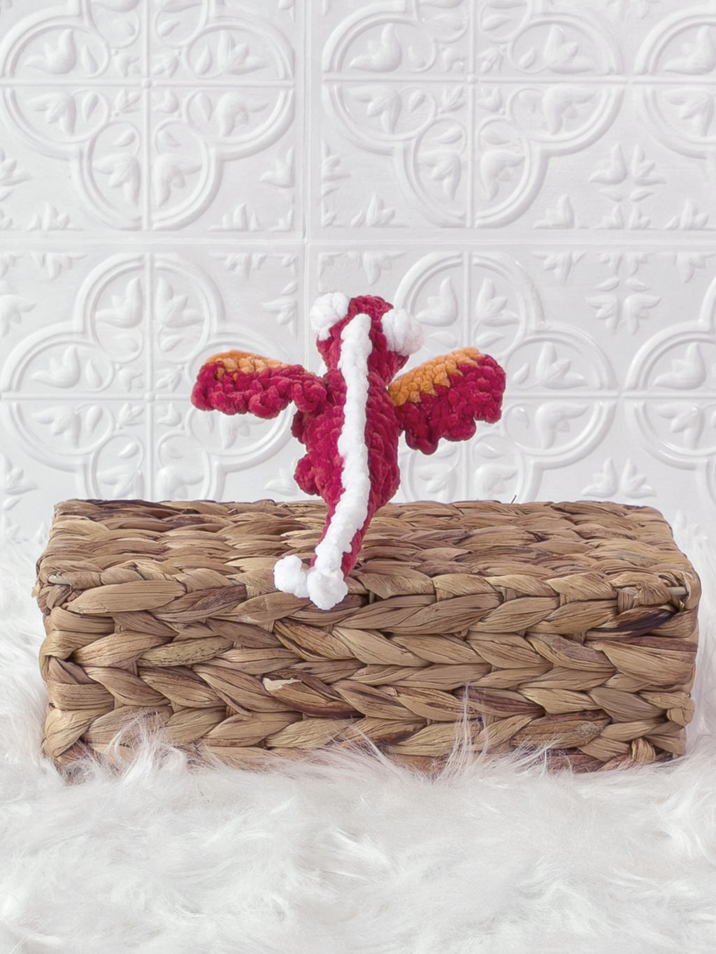 Handmade red mini dragon crochet plushie shown from the back
