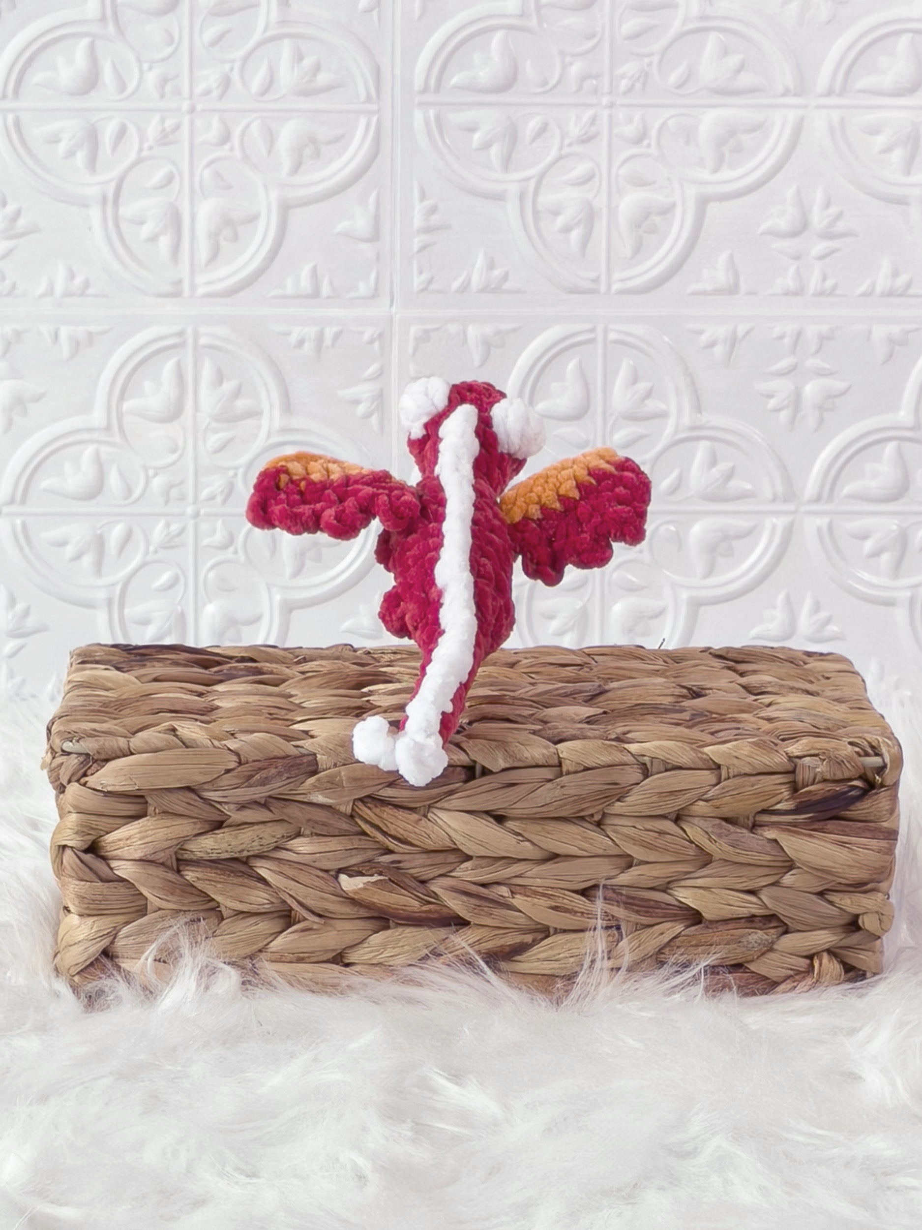 Handmade red mini dragon crochet plushie shown from the back
