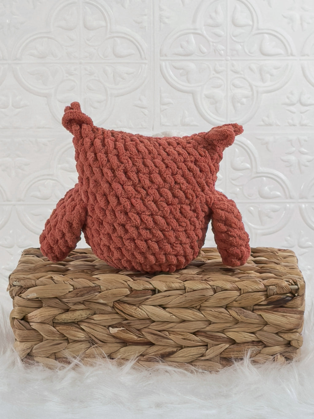 Handmade red owl crochet plushie shown from the back