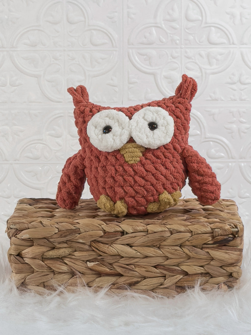 Handmade red owl crochet plushie shown from the front