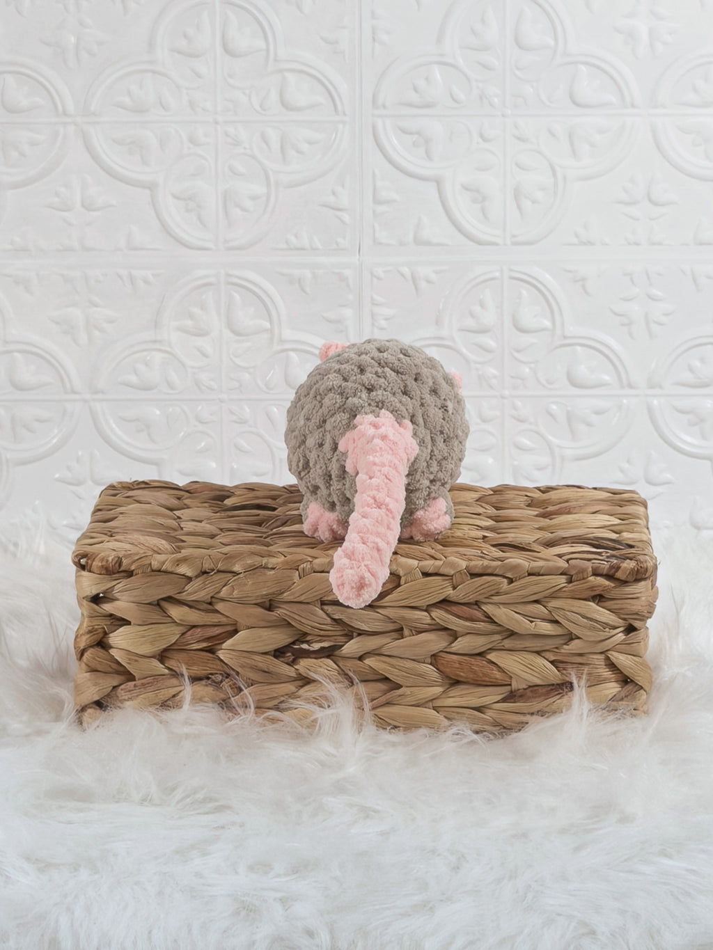 Handmade taupe rat crochet plushie shown from the back