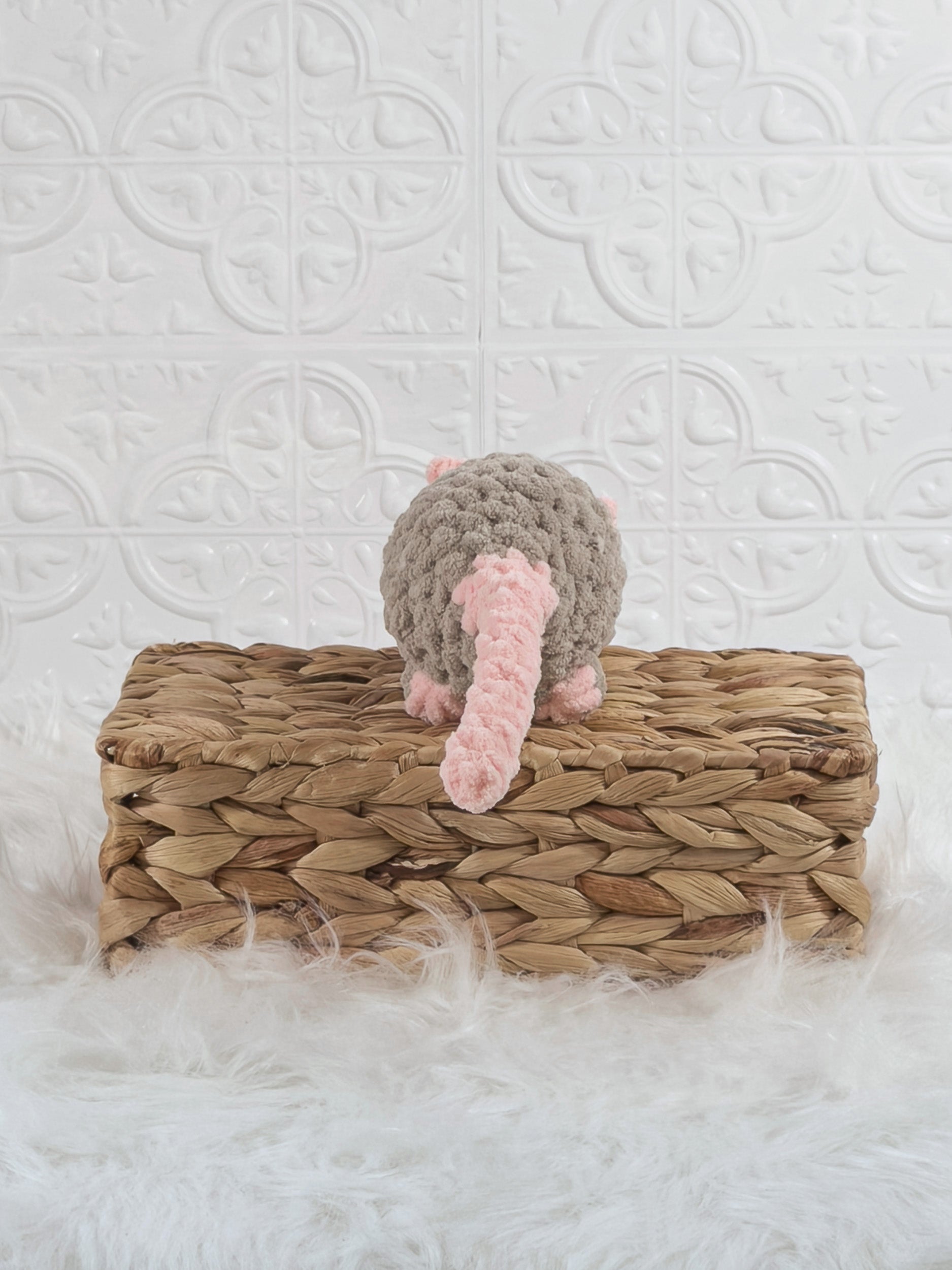 Handmade taupe rat crochet plushie shown from the back