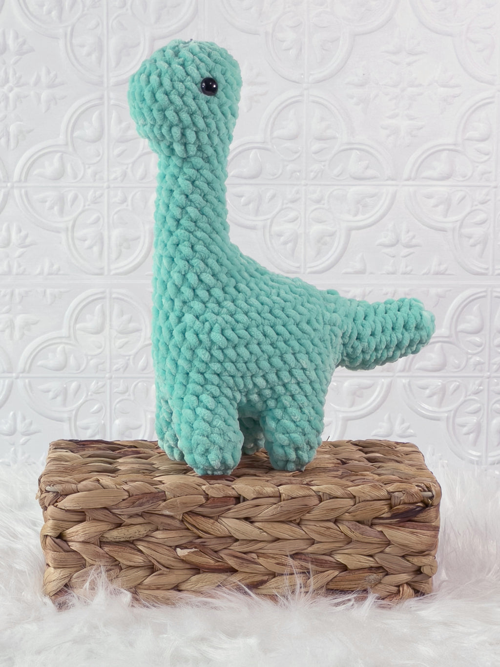 Handmade brachiosaurus crochet plushie shown from the front