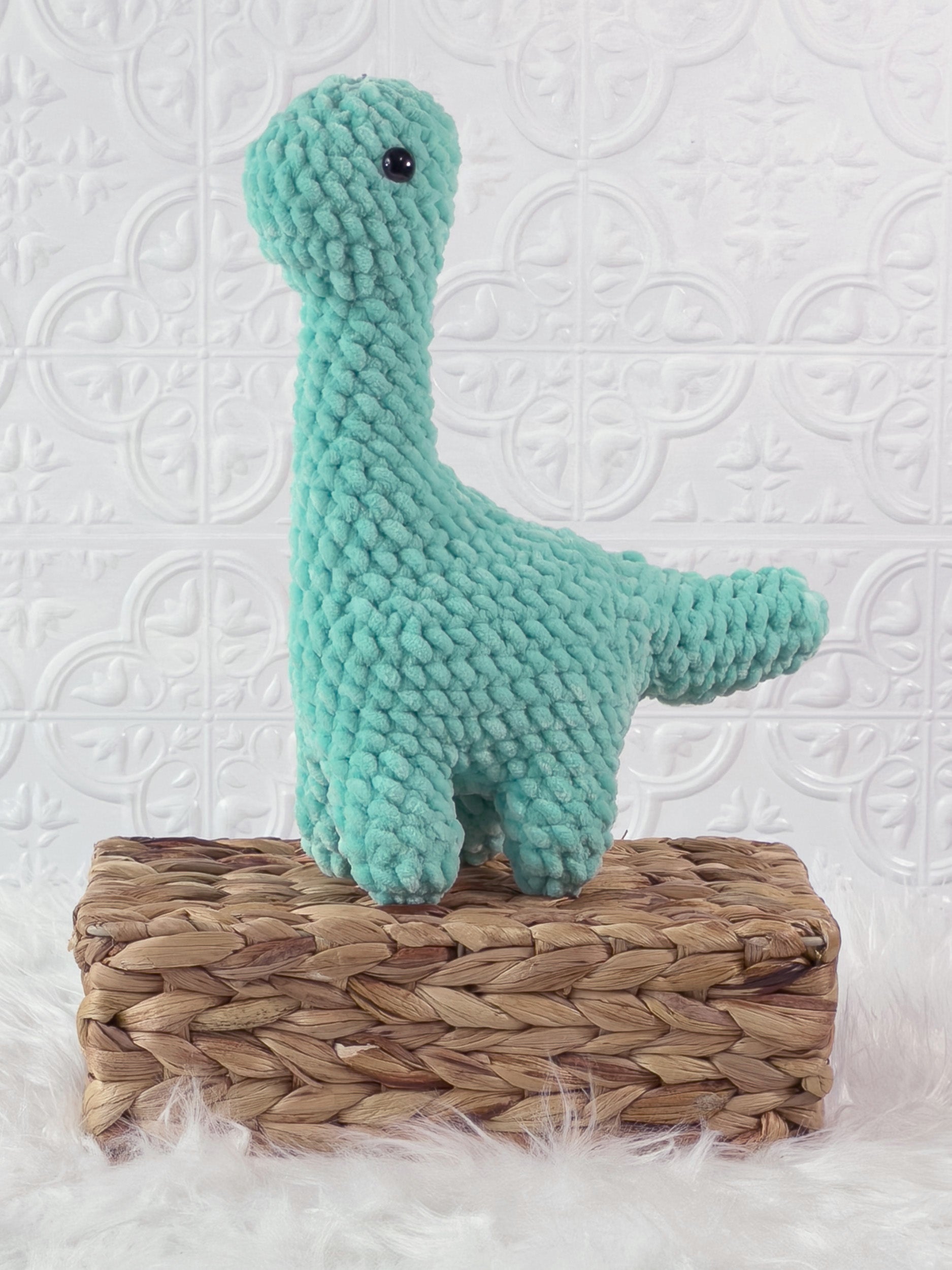 Handmade brachiosaurus crochet plushie shown from the front