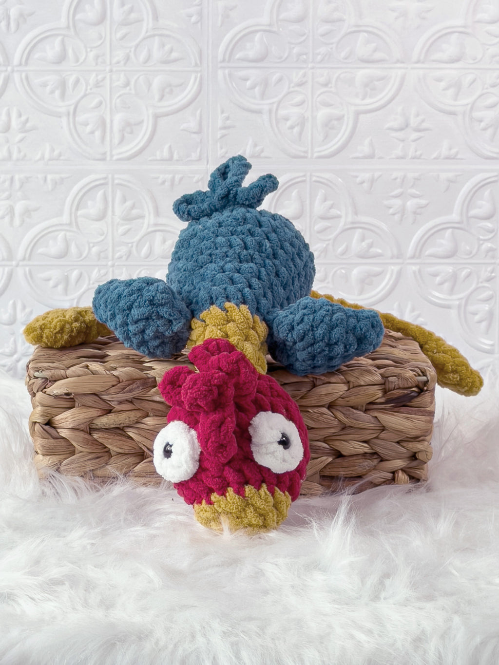 Handmade turquoise silly rooster crochet plushie shown from an angled view