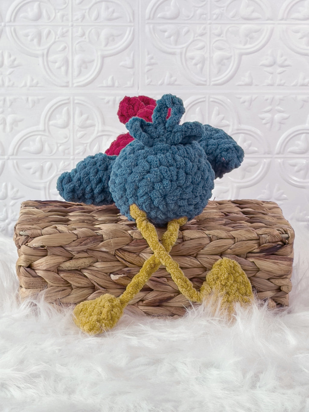 Handmade turquoise silly rooster crochet plushie shown from the back