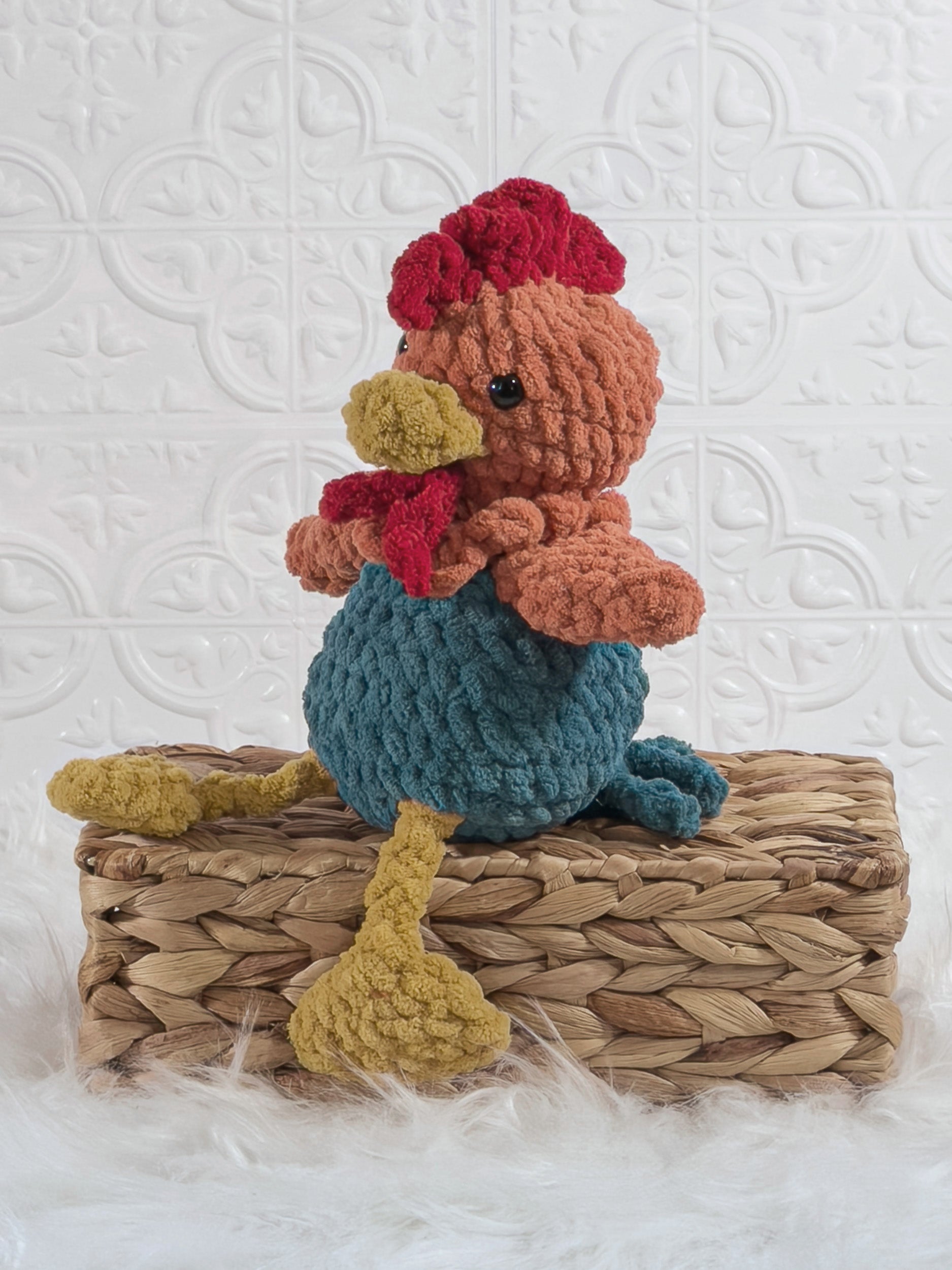 Handmade sitting rooster crochet plushie shown from the front