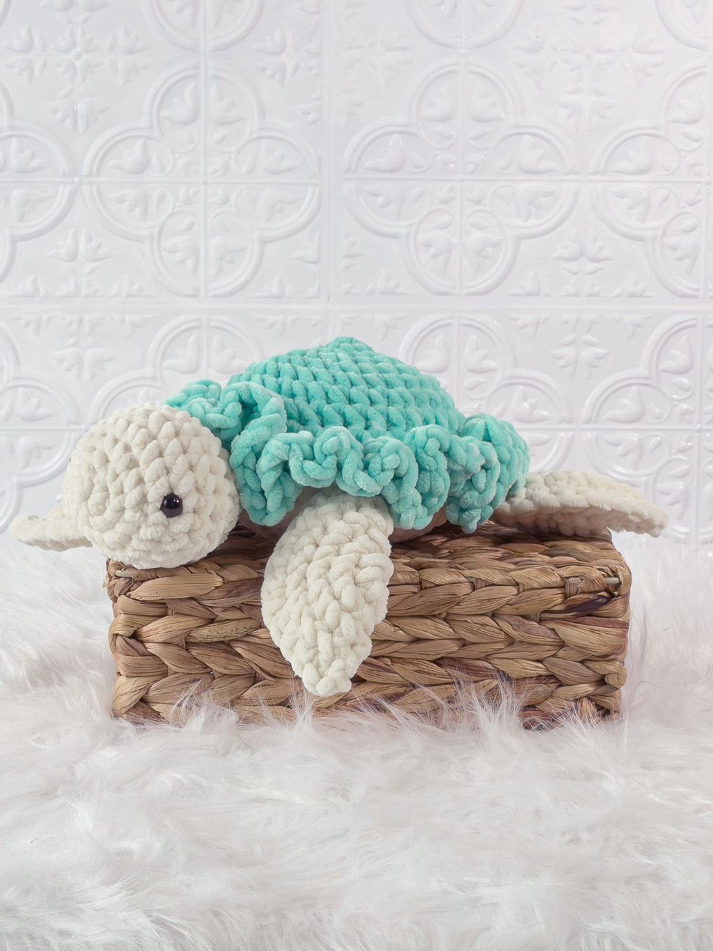 Handmade turtle crochet plushie shown from the front