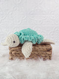 Handmade turtle crochet plushie shown from the front