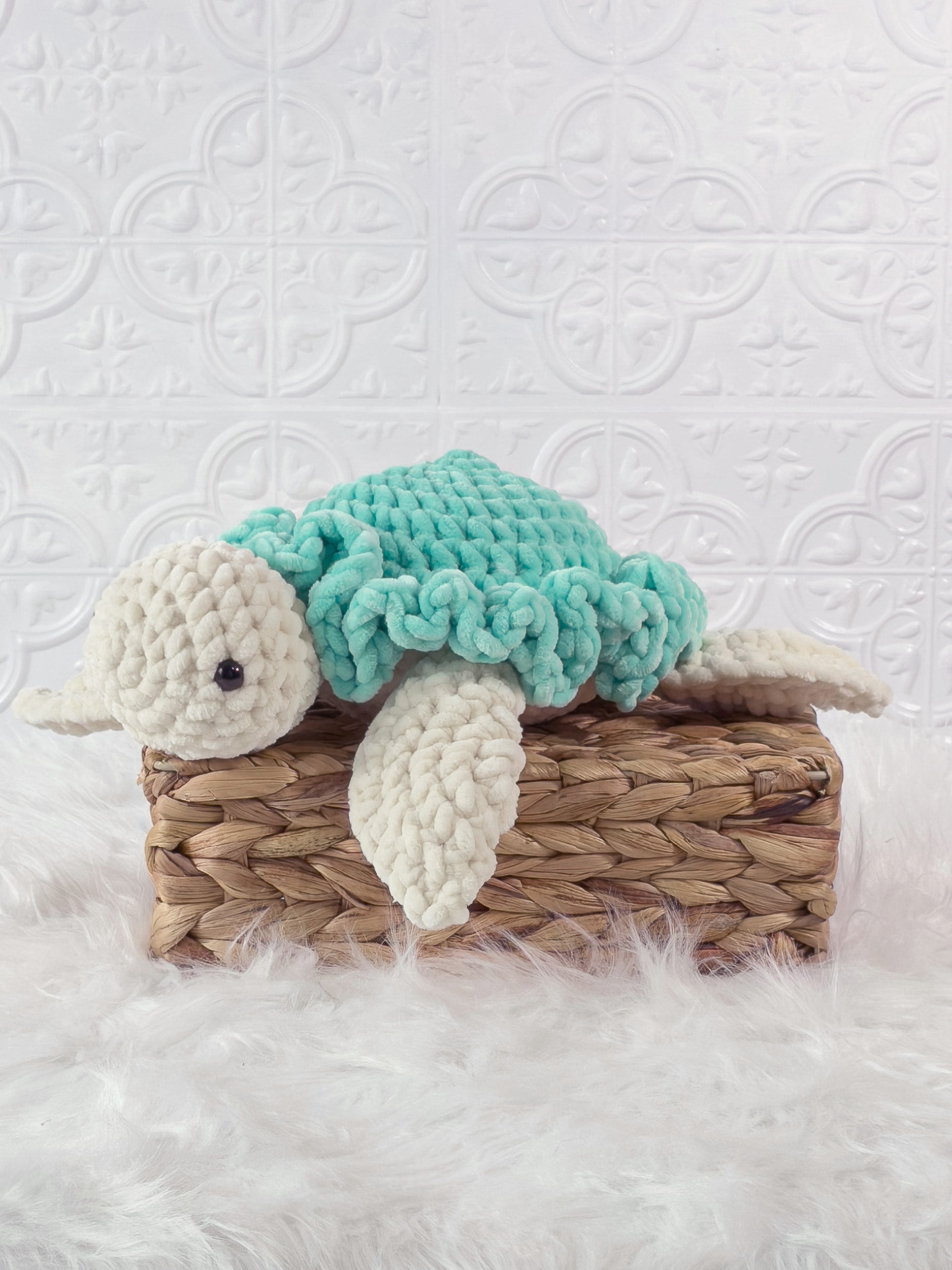 Handmade turtle crochet plushie shown from the front
