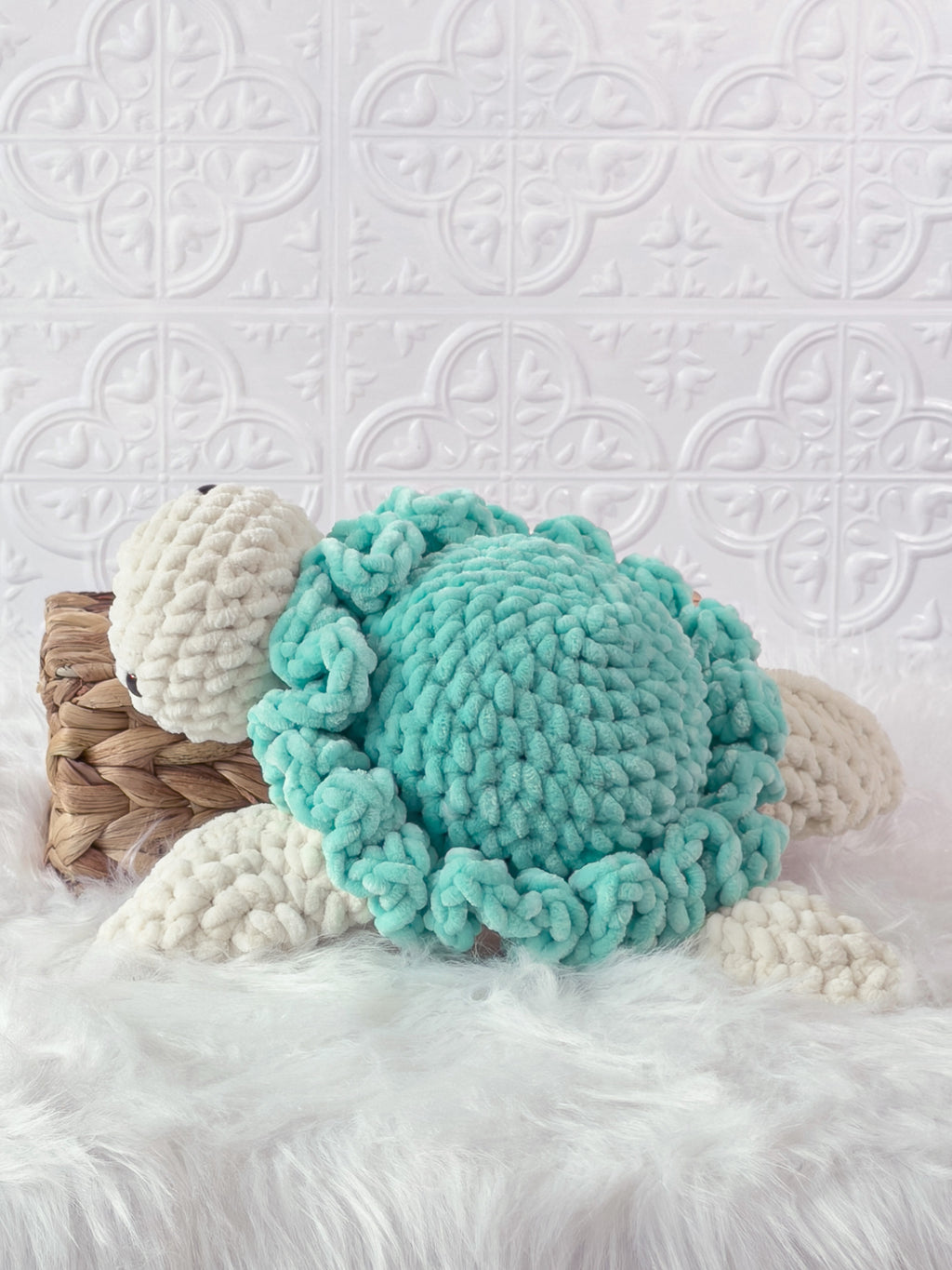 Handmade turquoise turtle crochet plushie shown in a swimming pose