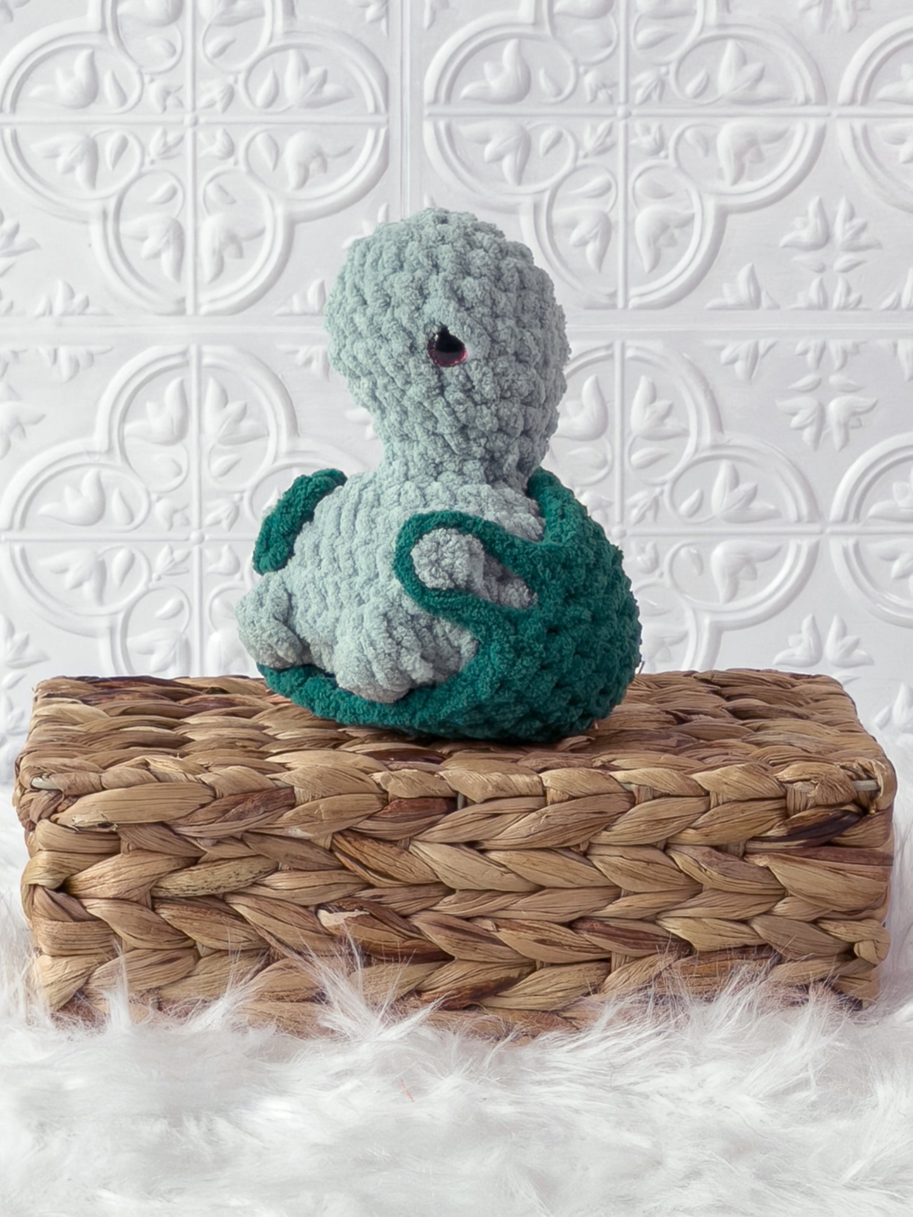 Handmade turtle crochet plushie shown from the front