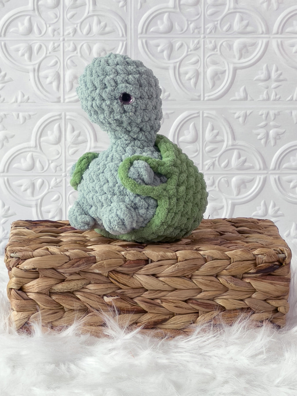 Handmade turtle crochet plushie shown from the front