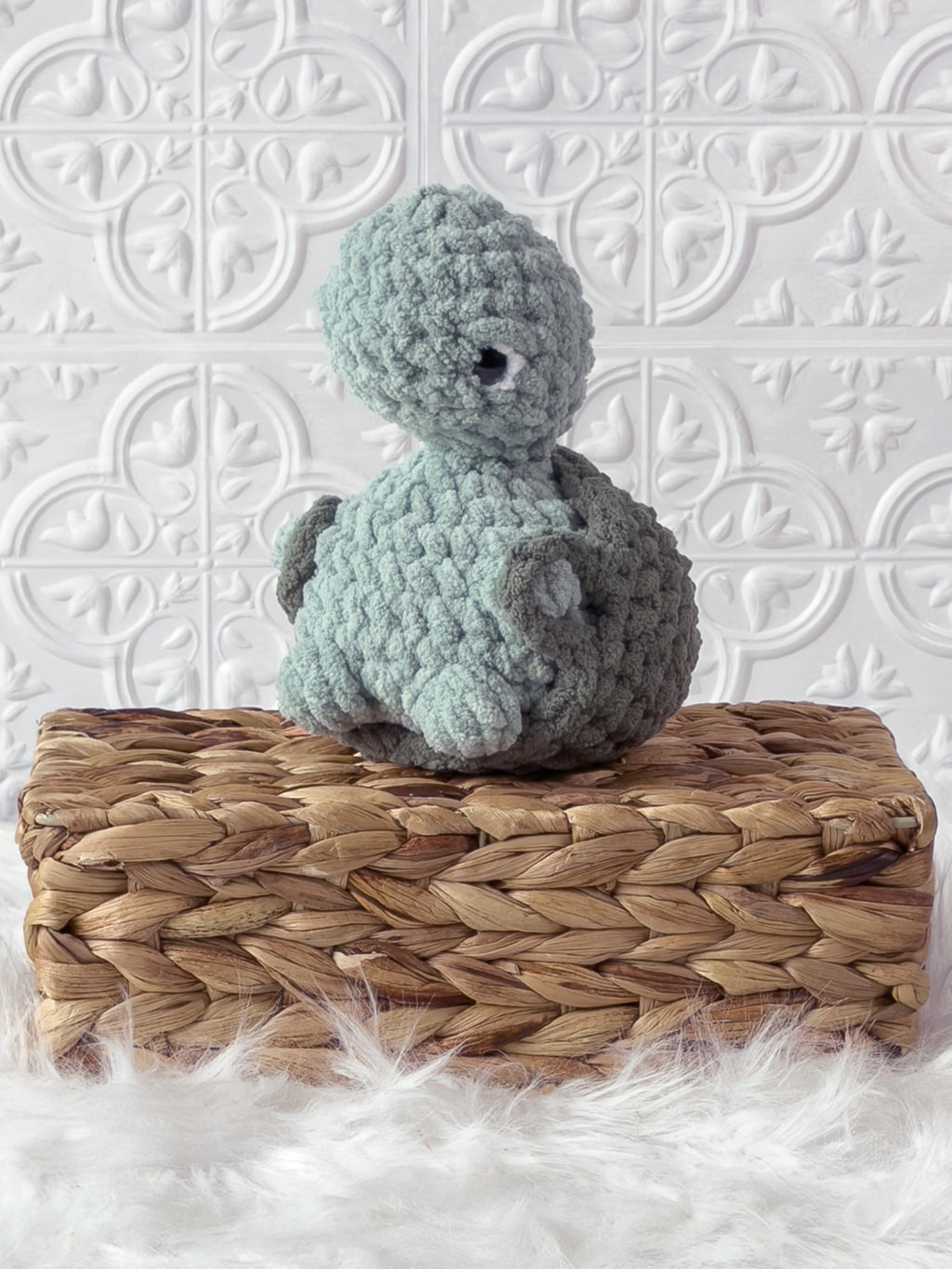 Handmade turtle crochet plushie shown from the front