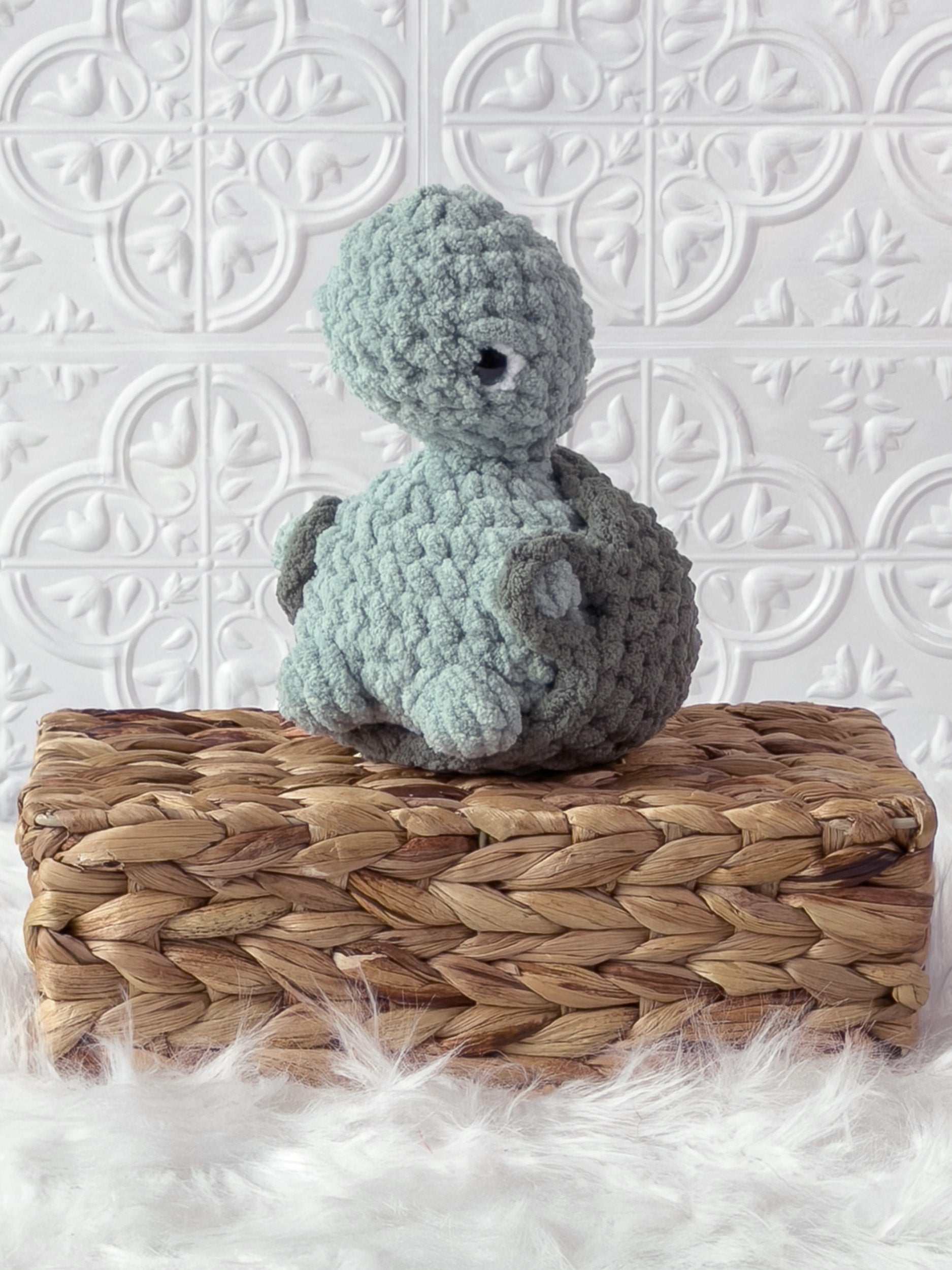 Handmade turtle crochet plushie shown from the front