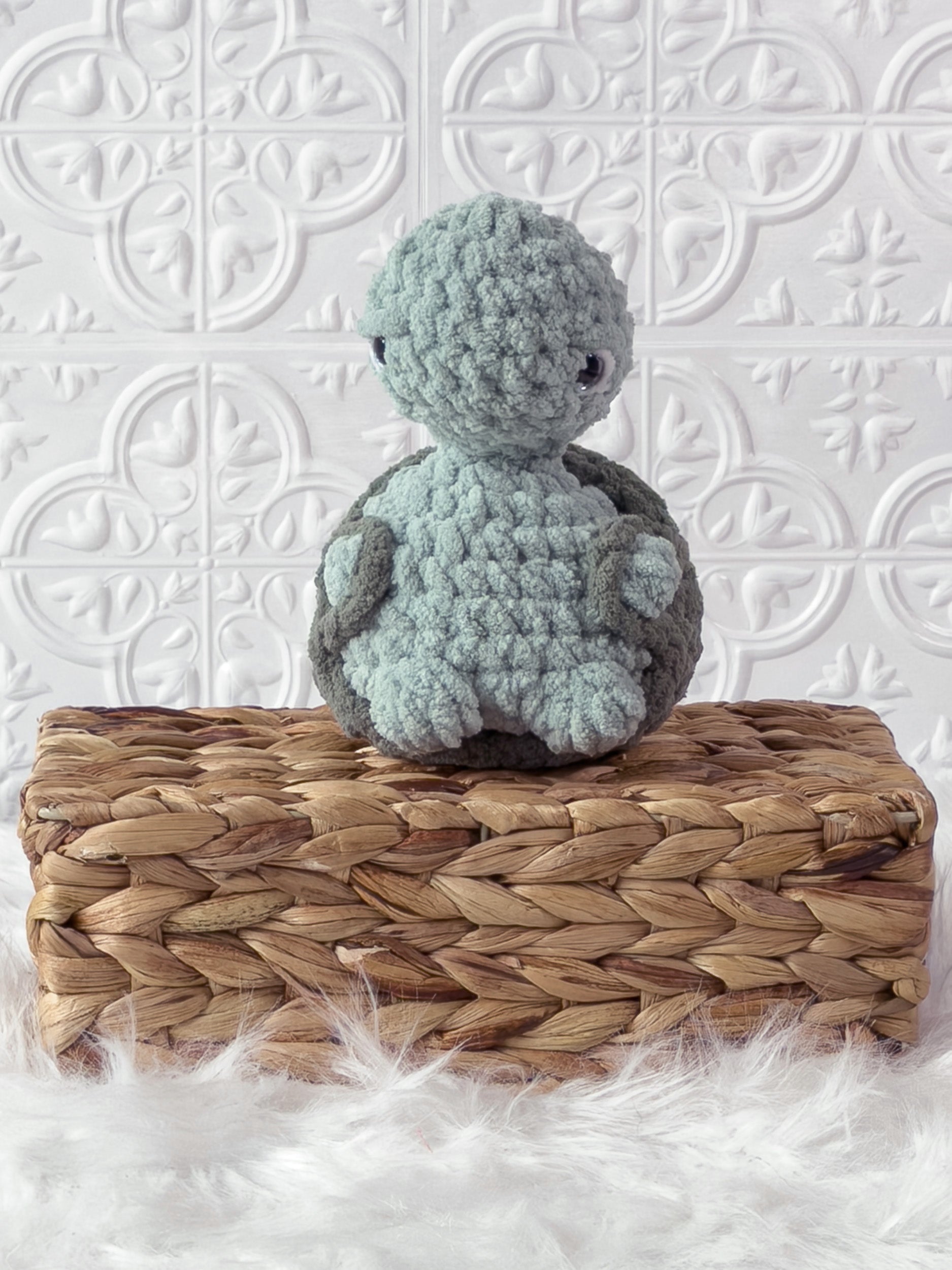 Handmade turquoise, medium turtle crochet plushie shown from the front