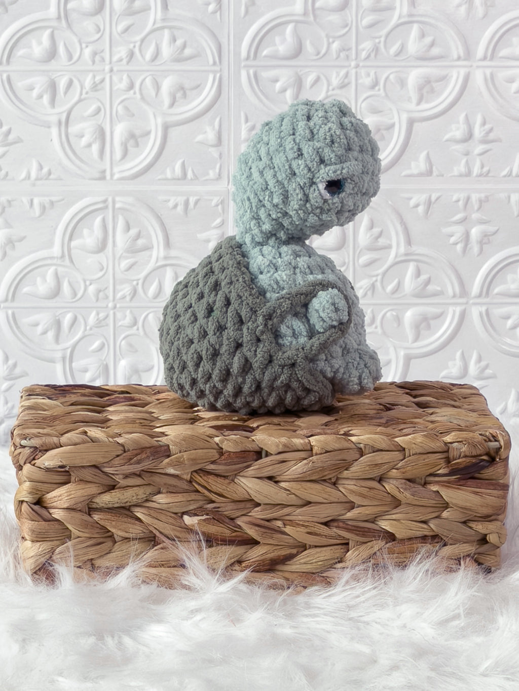 Handmade turquoise, medium turtle crochet plushie shown from the side