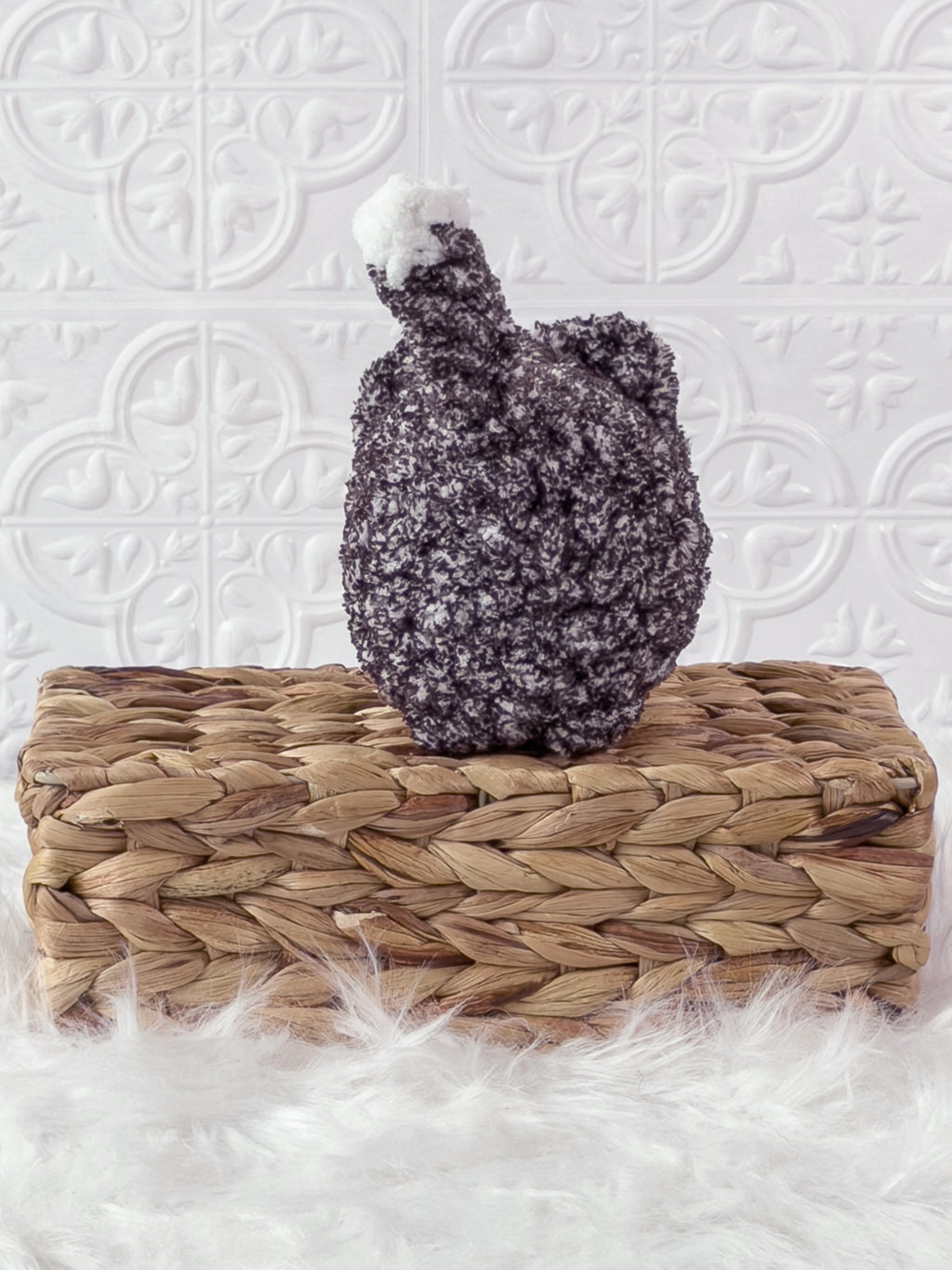 Handmade tweed, black loaf cat crochet plushie shown from the back