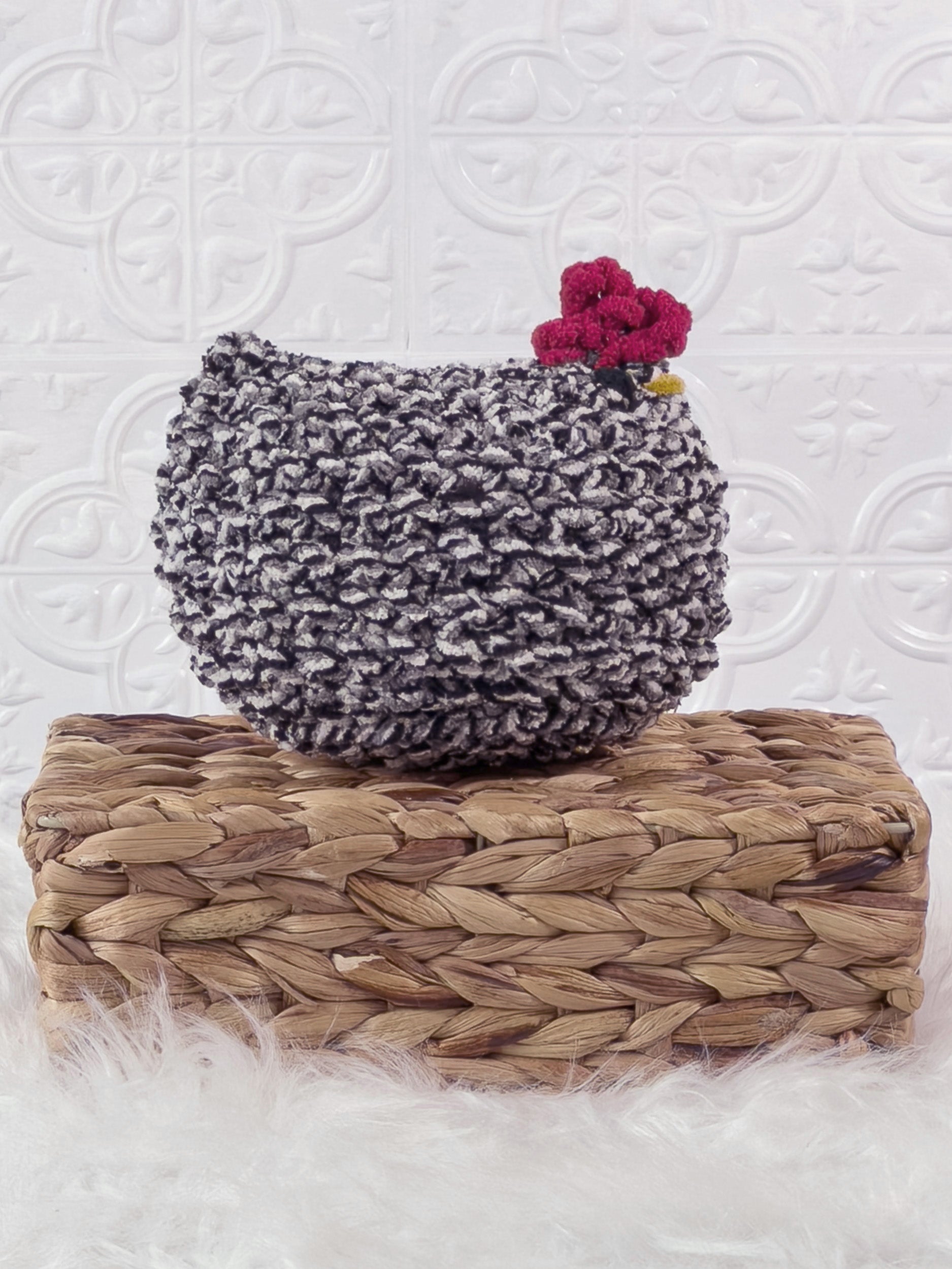 Handmade tweed, black chicken crochet plushie shown from the side