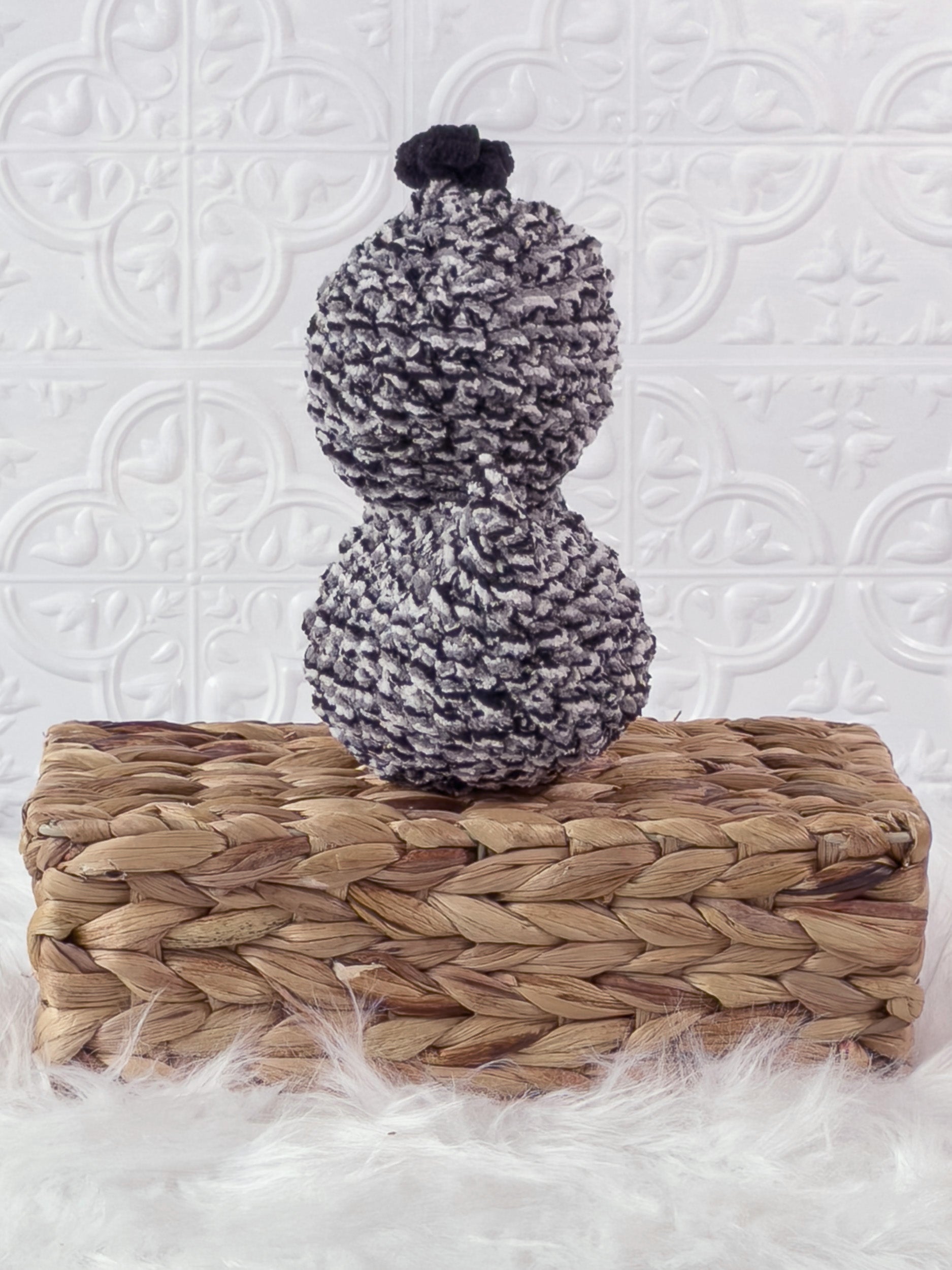 Handmade tweed, black rubber duck crochet plushie shown from the back