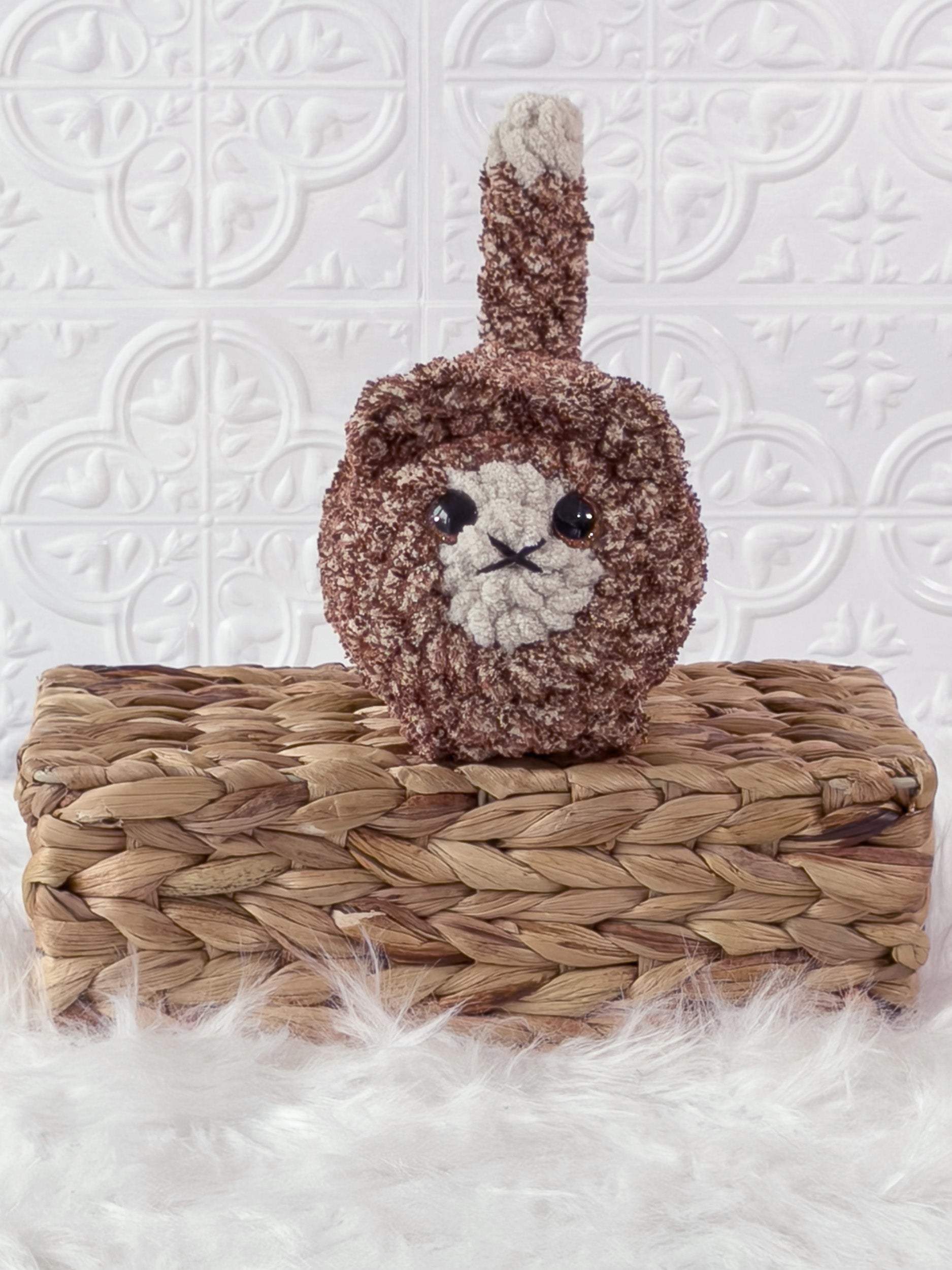 Handmade tweed, brown loaf cat crochet plushie shown from the front