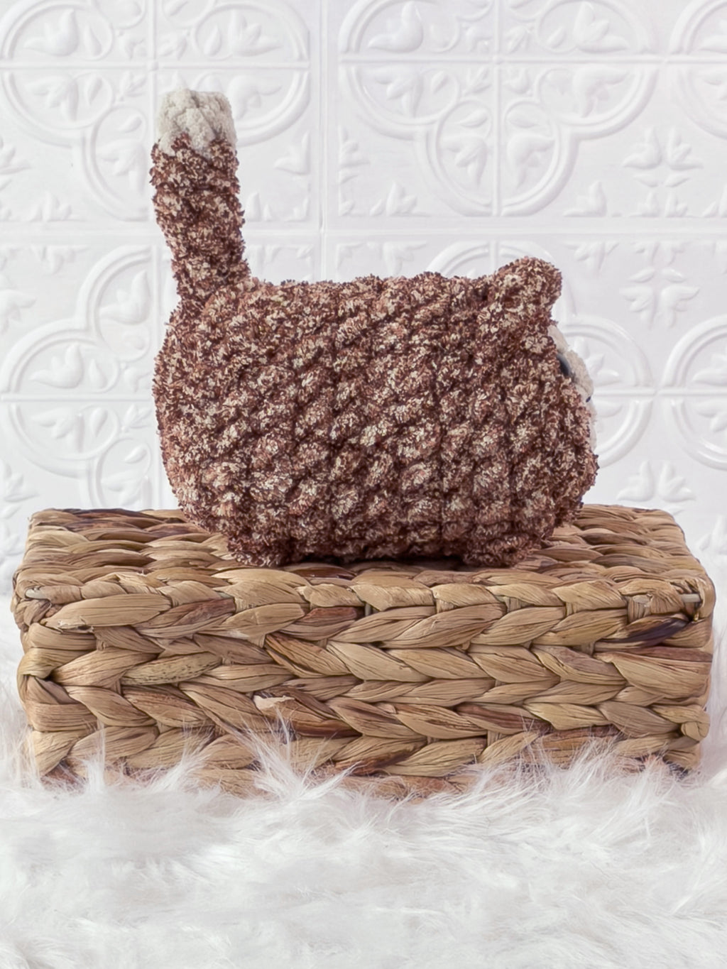 Handmade tweed, brown loaf cat crochet plushie shown from the side