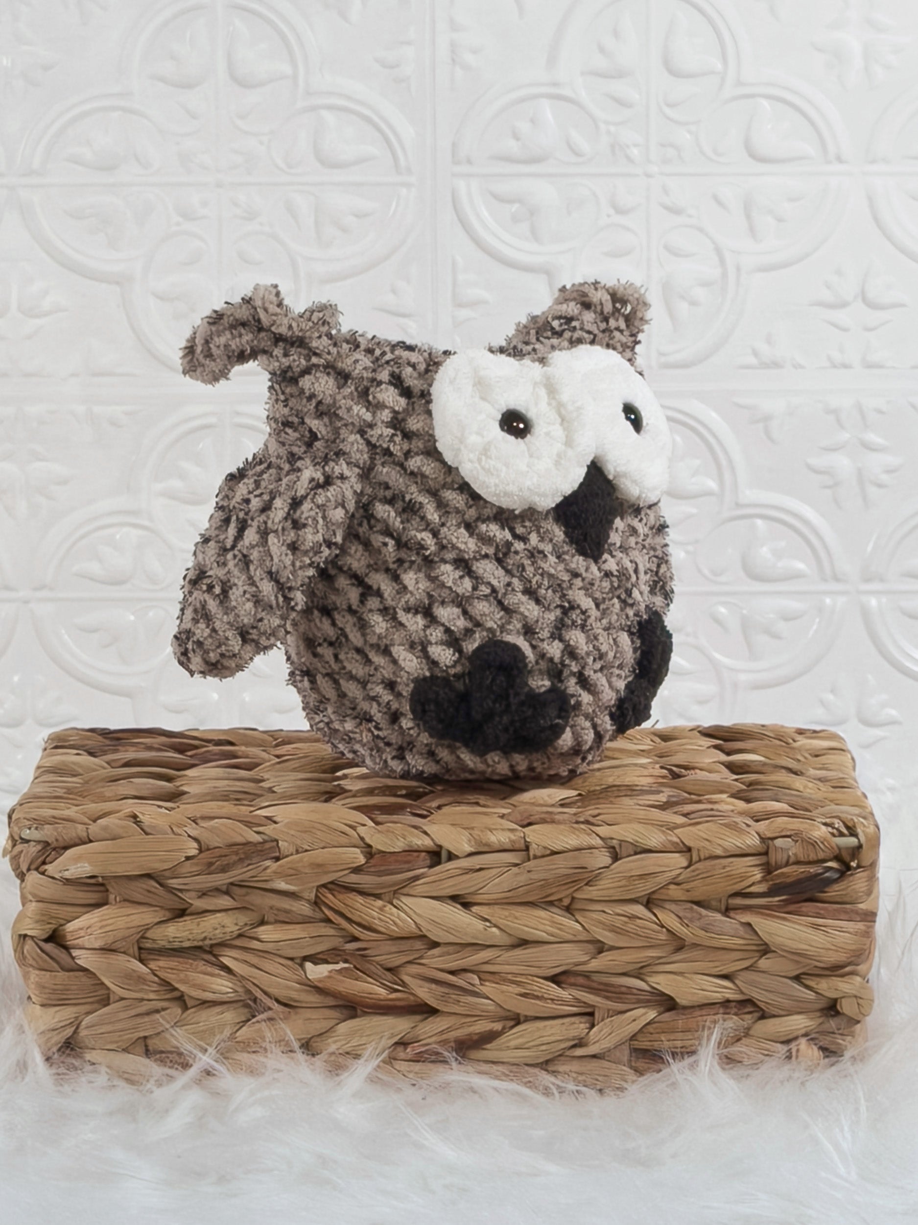 Handmade tweed owl crochet plushie shown from an angled view