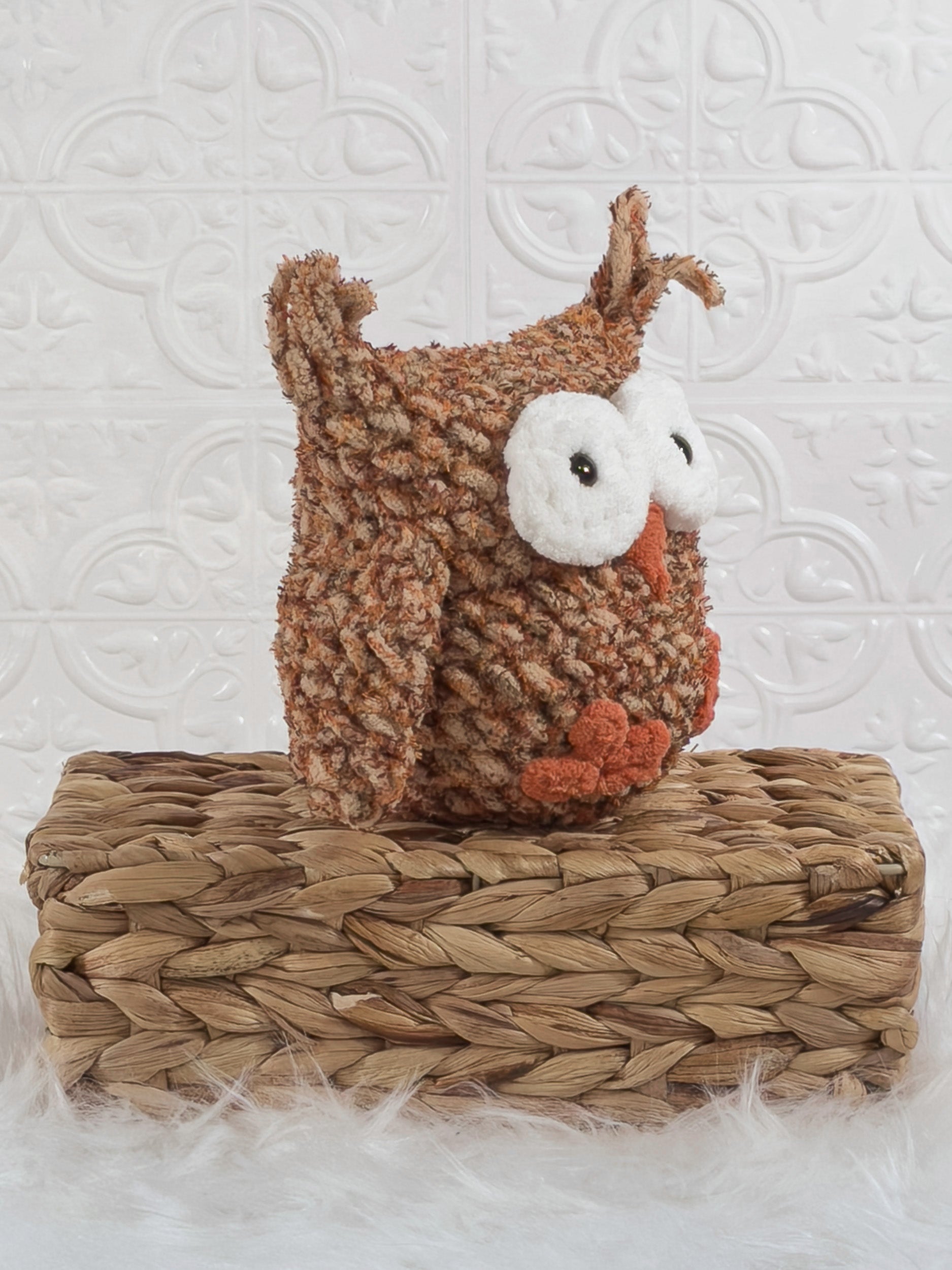 Handmade tweed owl crochet plushie shown from an angled view