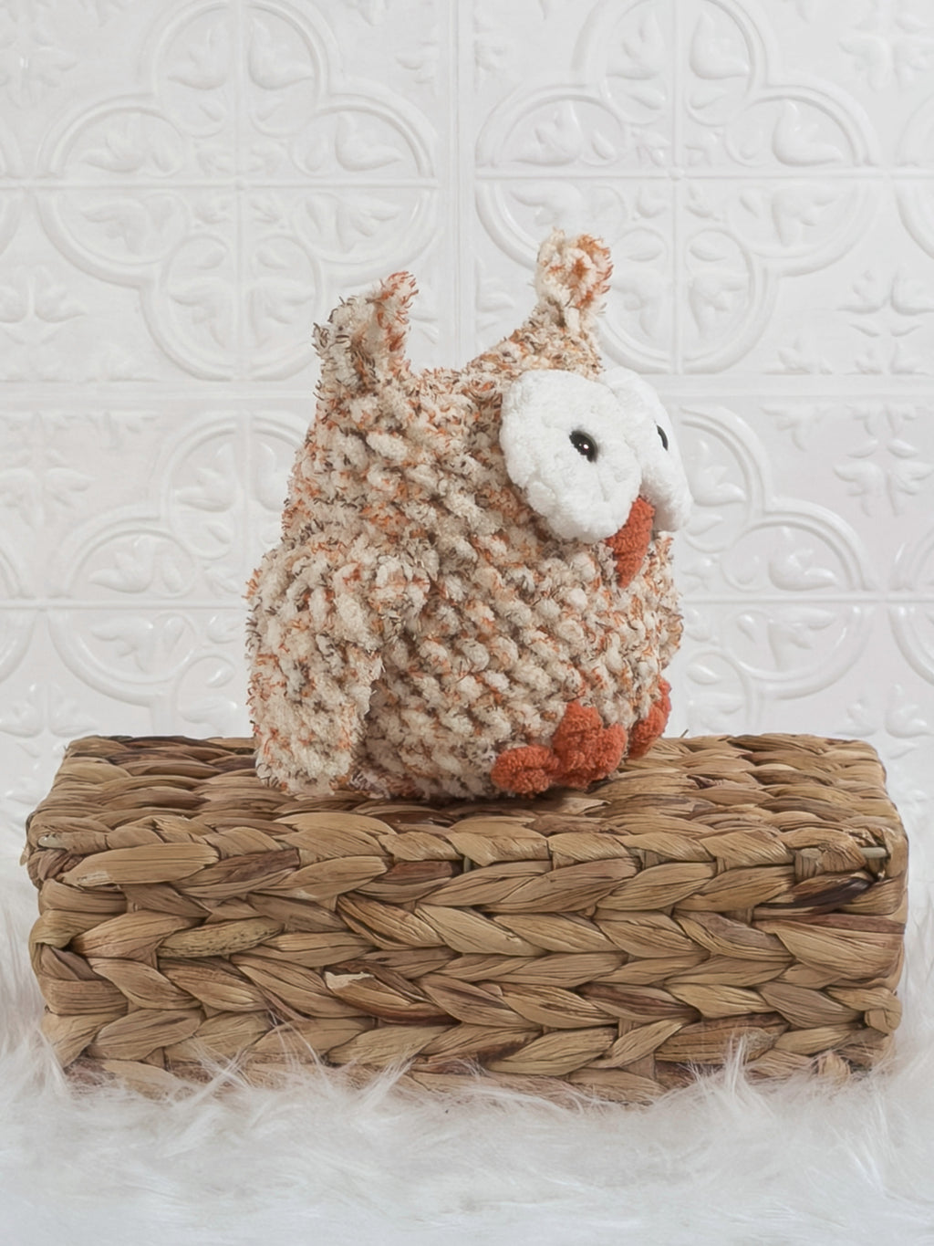 Handmade tweed owl crochet plushie shown from an angled view