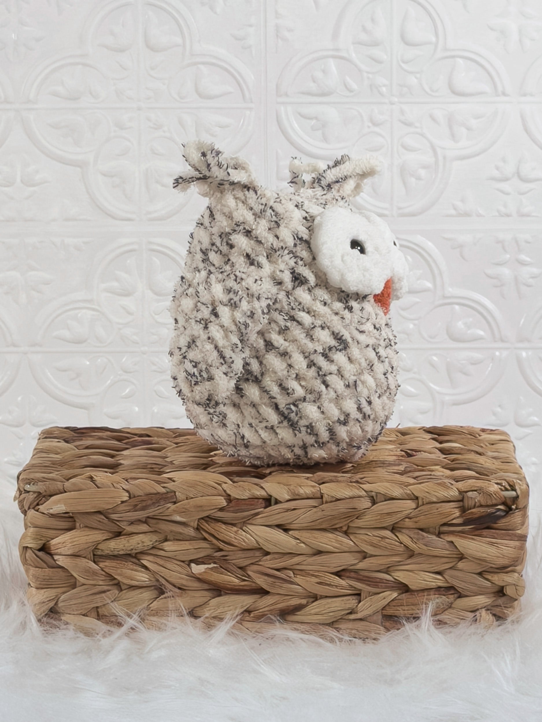 Handmade tweed owl crochet plushie shown from an angled view