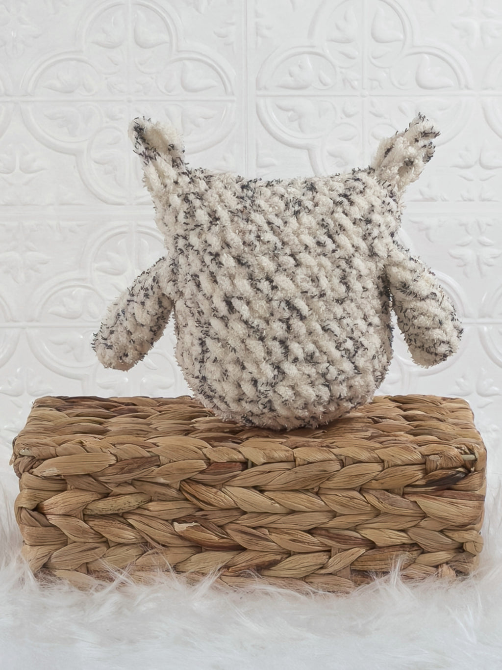 Handmade tweed owl crochet plushie shown from the back