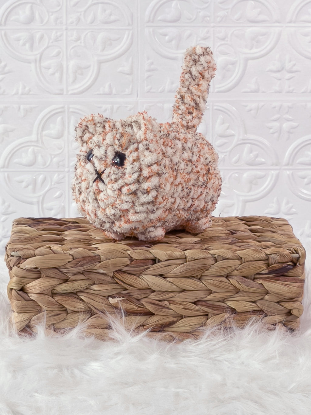 Handmade tweed, orange loaf cat crochet plushie shown from the front