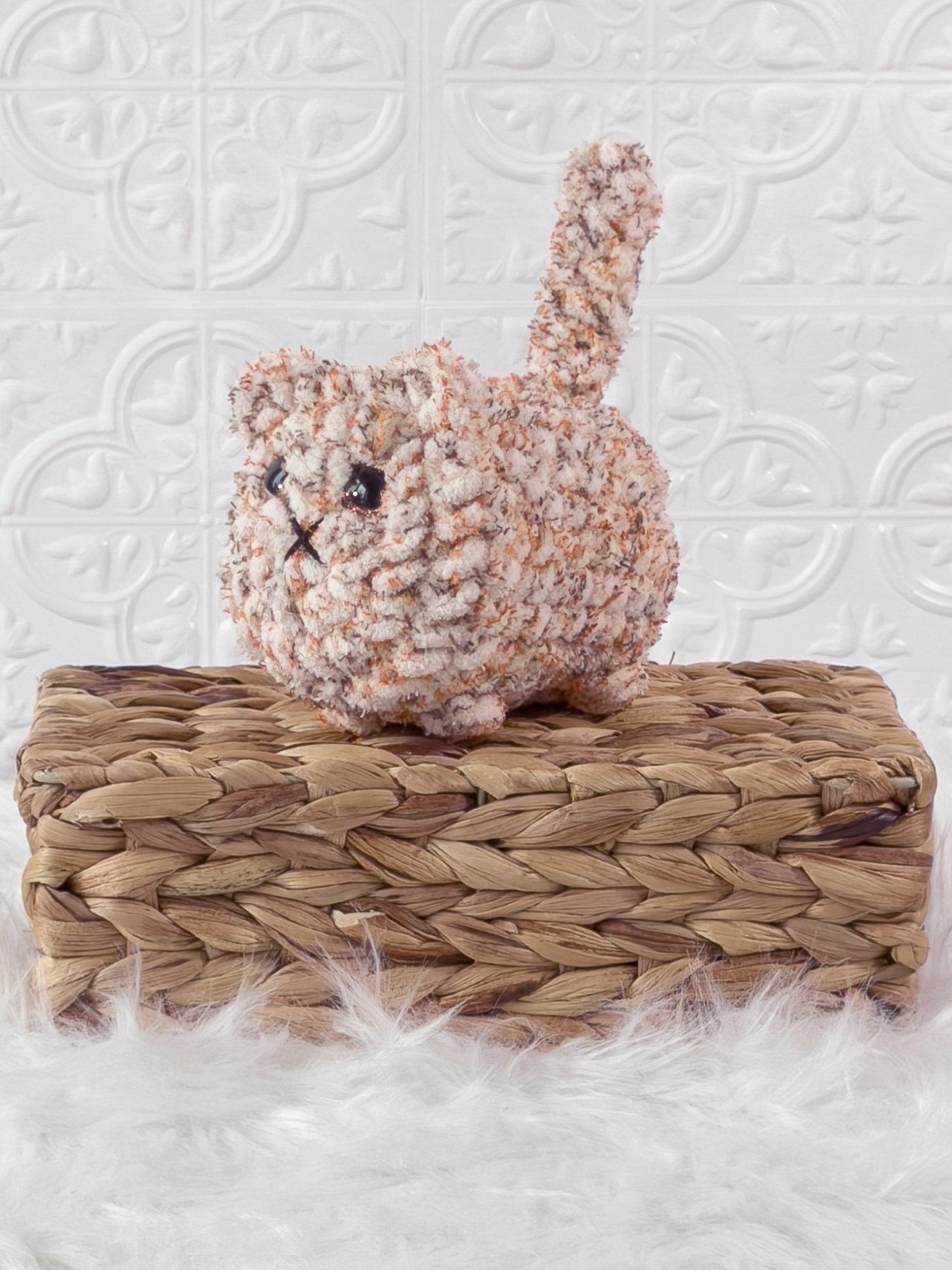 Handmade tweed, orange loaf cat crochet plushie shown from the front