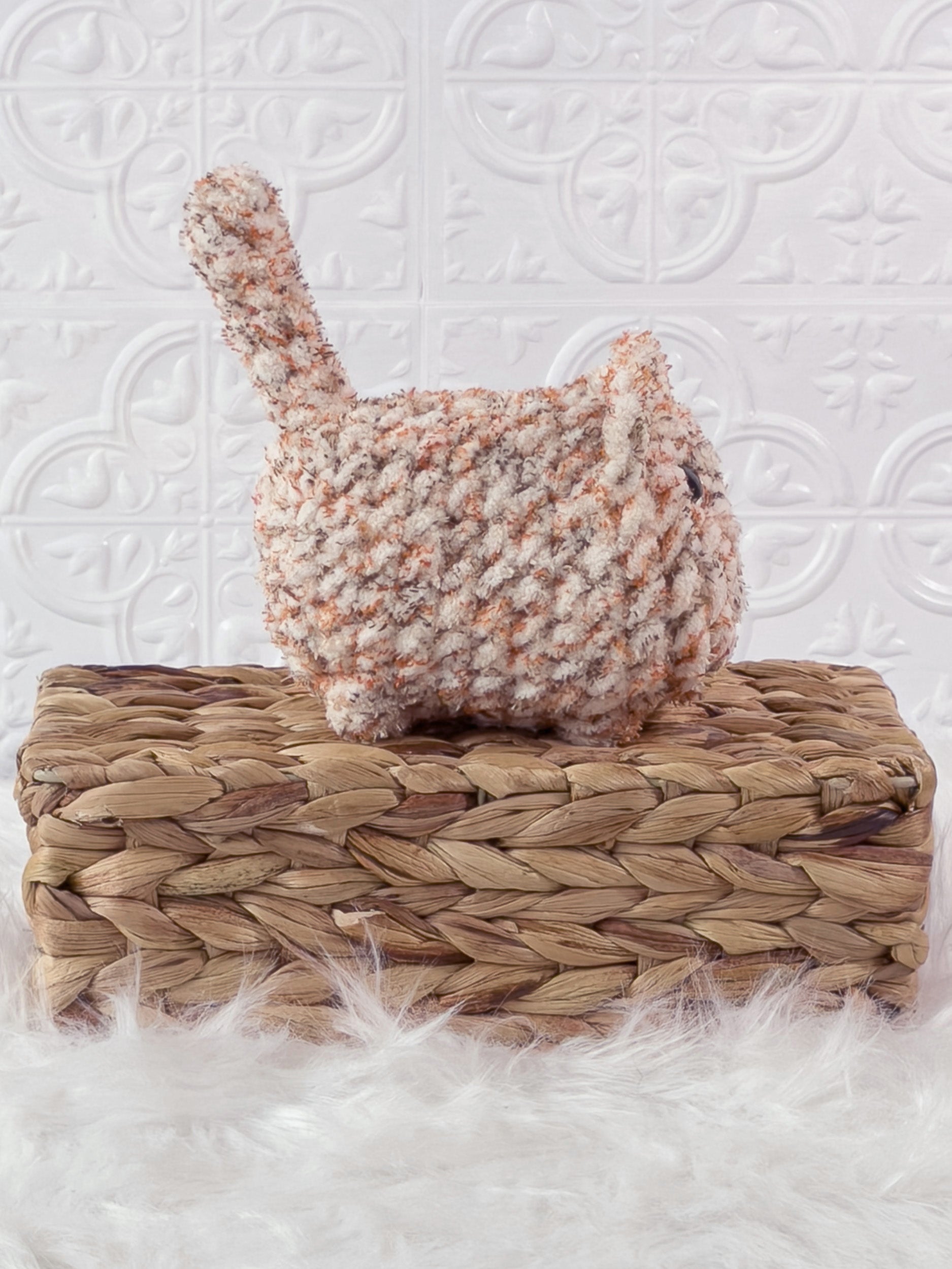 Handmade tweed, orange loaf cat crochet plushie shown from the side