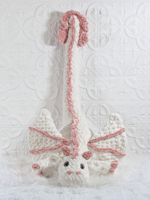 Handmade white dragon crochet plushie shown in a close-up detail view
