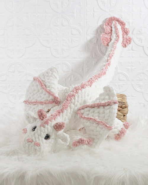 Handmade white dragon crochet plushie shown from a front angle