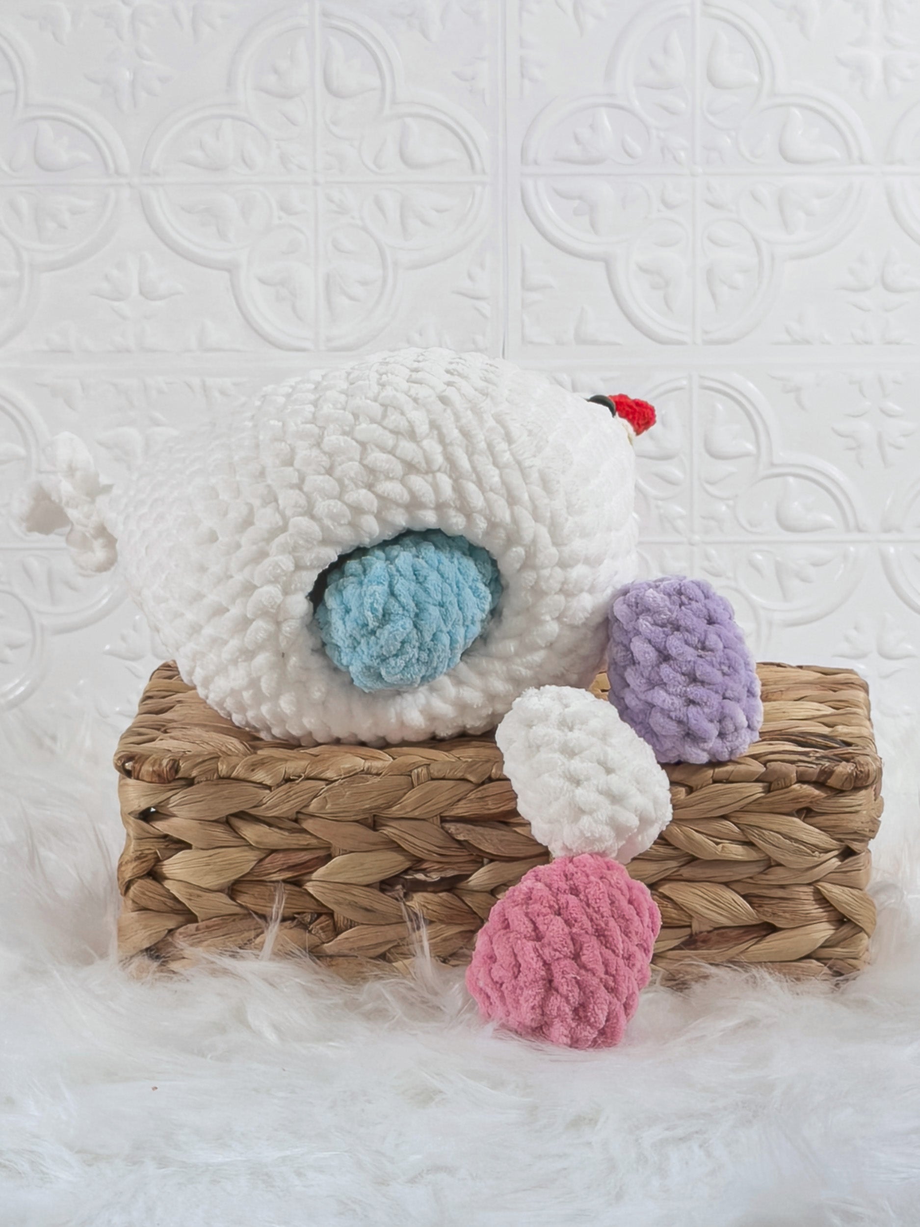 Handmade white hen with eggs crochet plushie shown from the back