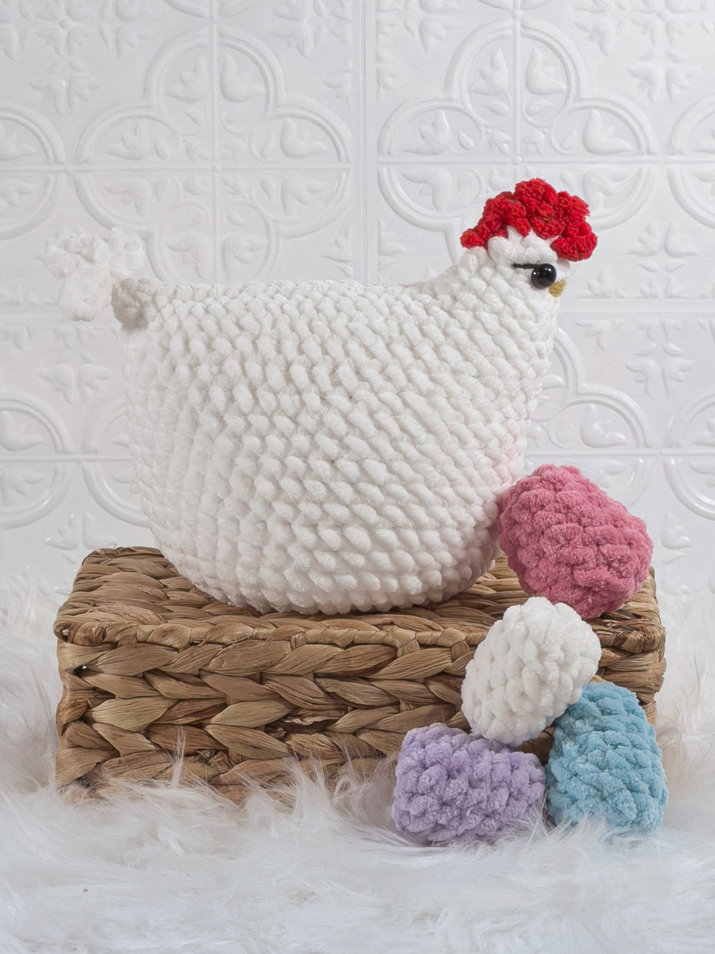 Handmade white hen with eggs crochet plushie shown from the side