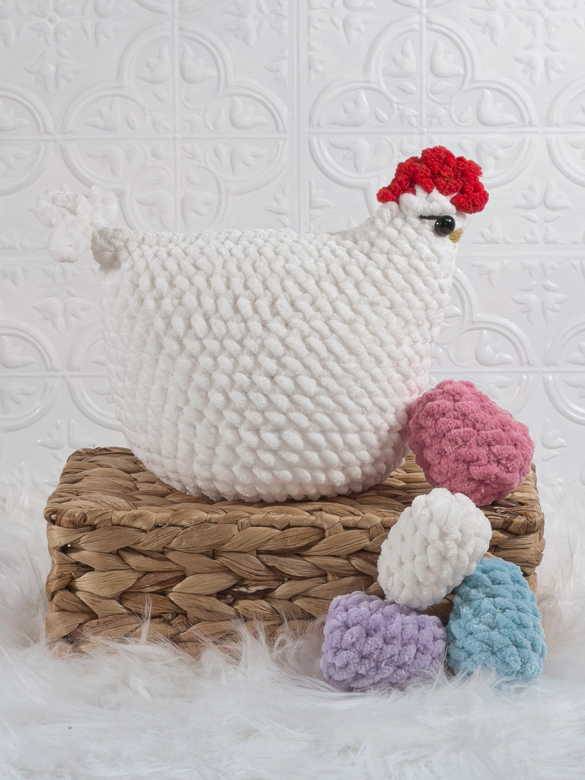 Handmade white hen with eggs crochet plushie shown from the side