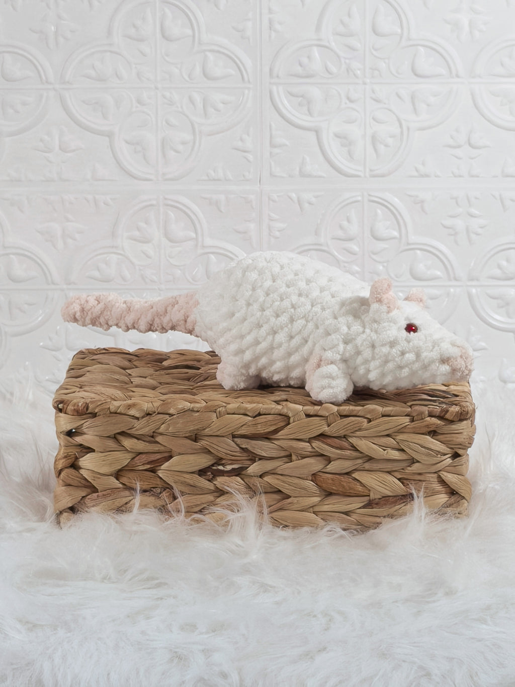 Handmade white rat crochet plushie shown from an angled view