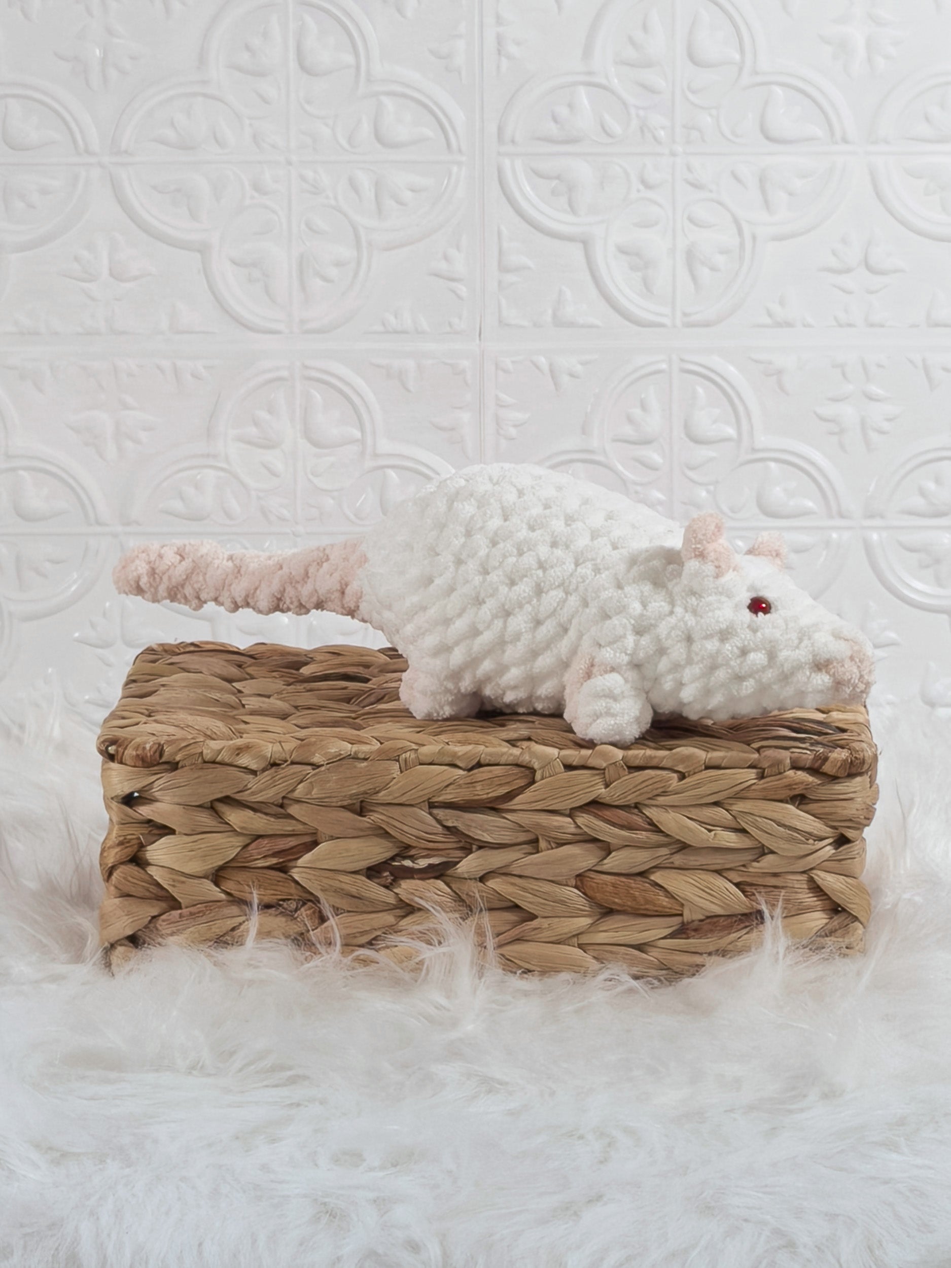 Handmade white rat crochet plushie shown from an angled view