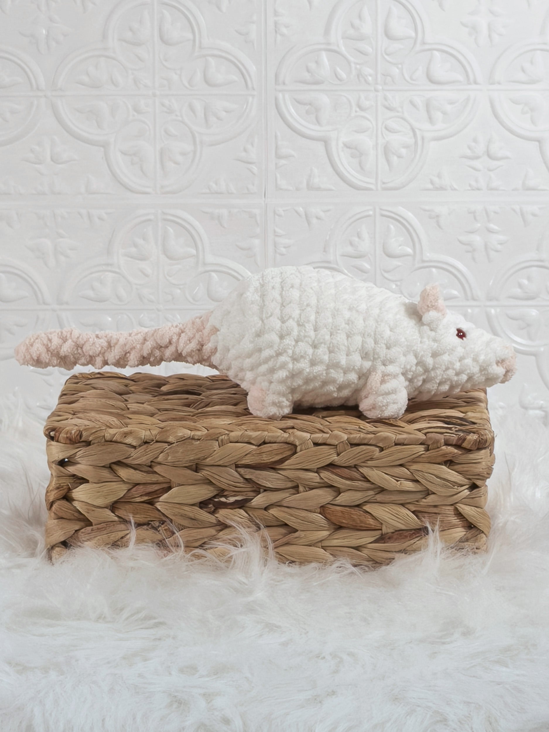 Handmade white rat crochet plushie shown from the side
