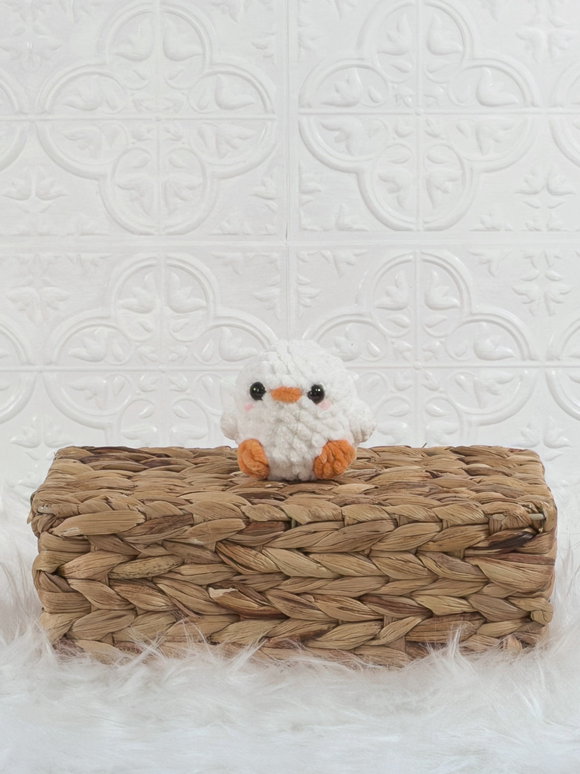 Handmade white, orange baby chick crochet plushie shown from the front