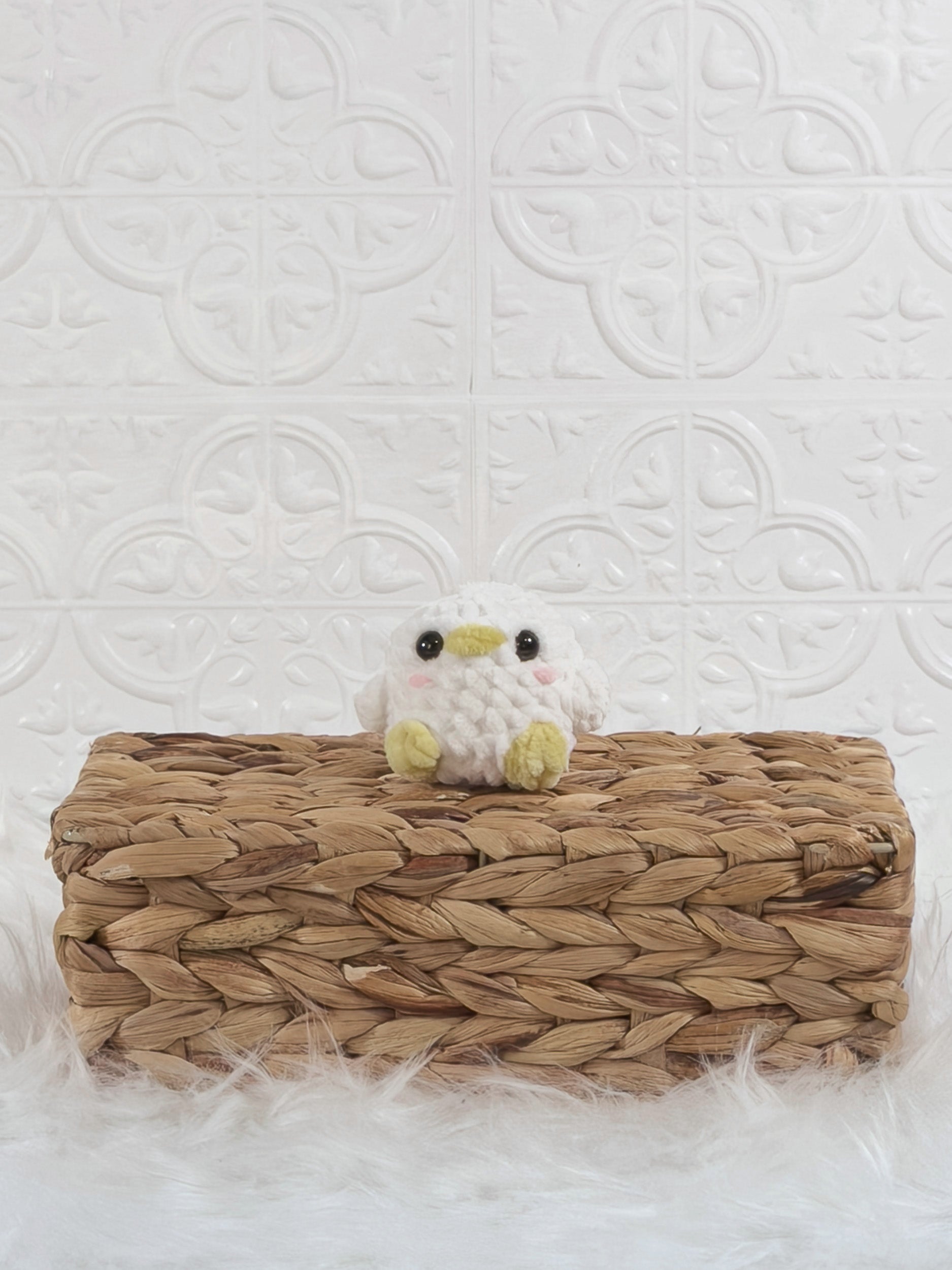 Handmade white, yellow baby chick crochet plushie shown from the front