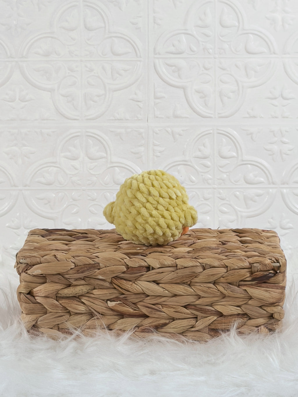 Handmade yellow baby chick crochet plushie shown from the back