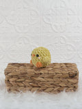 Handmade baby chick crochet plushie shown from the front