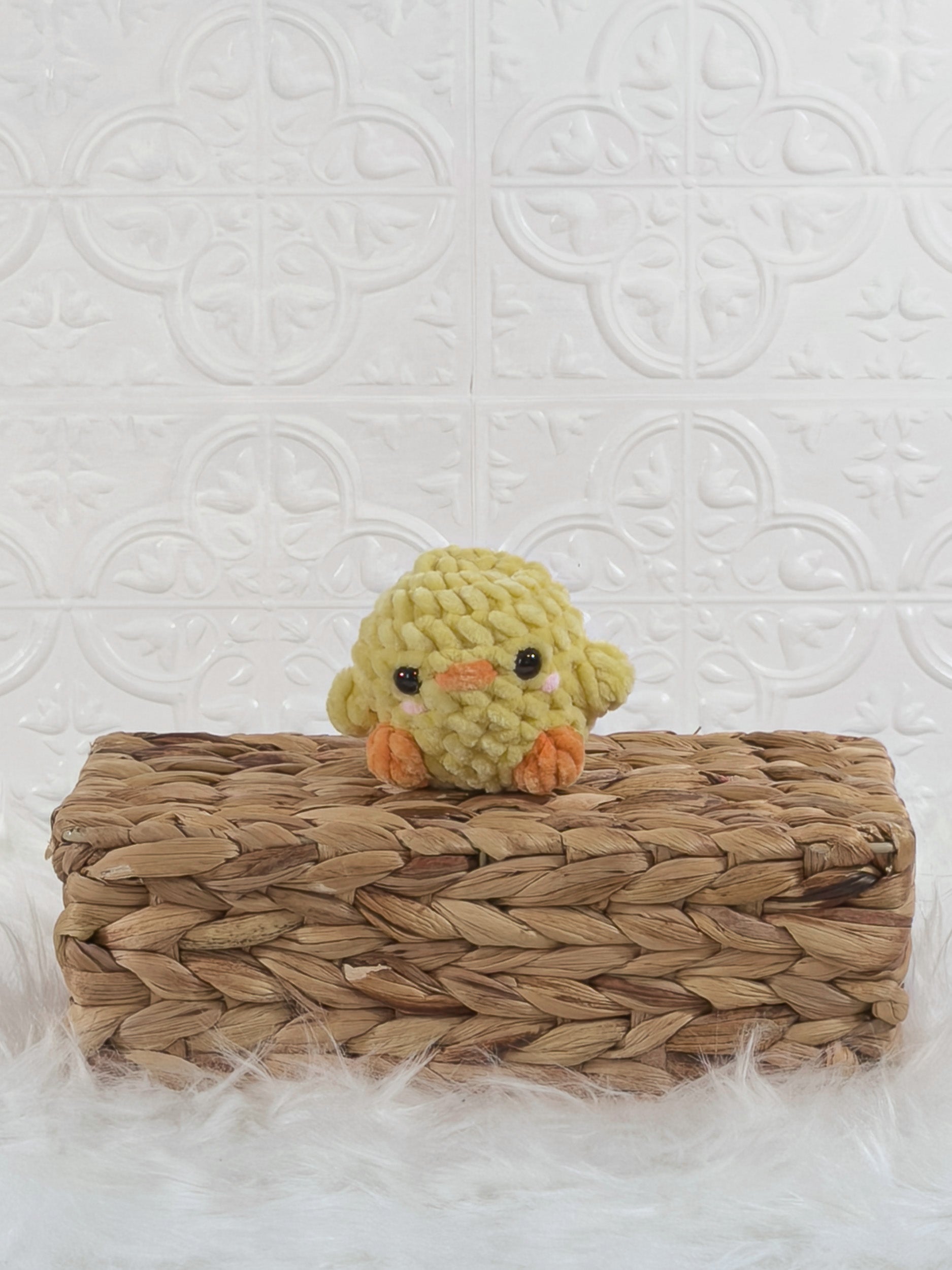 Handmade yellow baby chick crochet plushie shown from the front