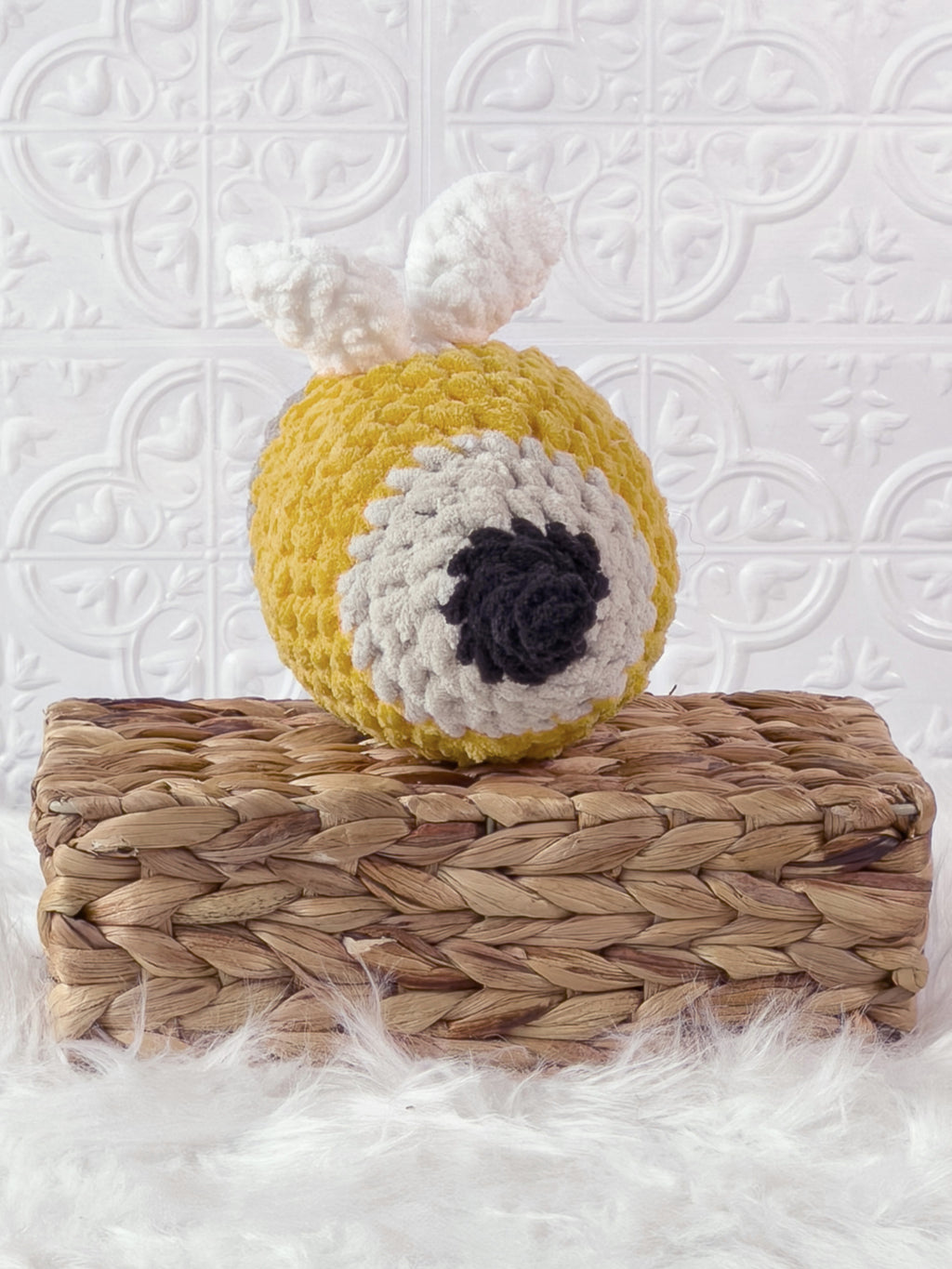Handmade yellow bee pencil crochet plushie shown from the back