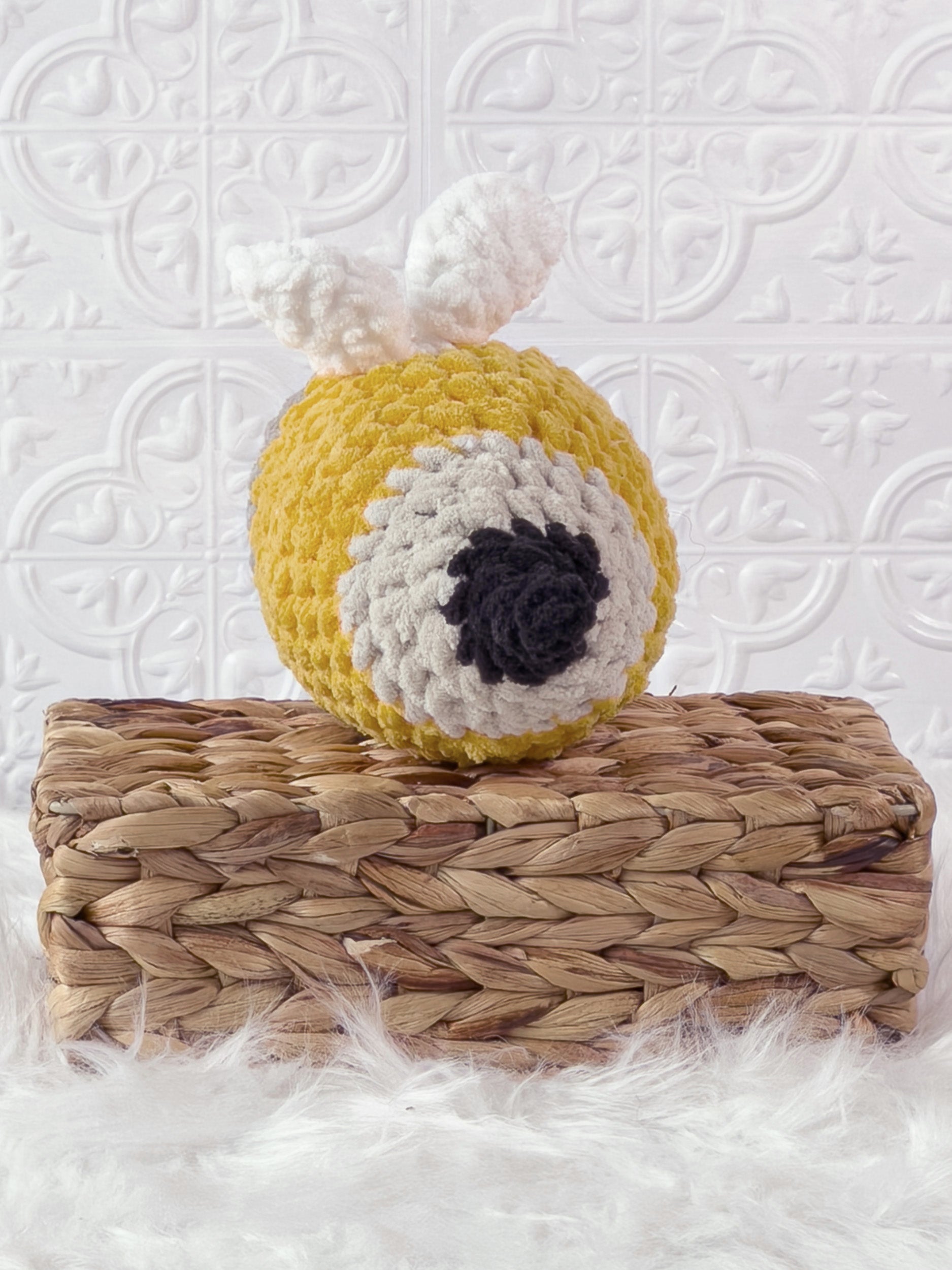 Handmade yellow bee pencil crochet plushie shown from the back